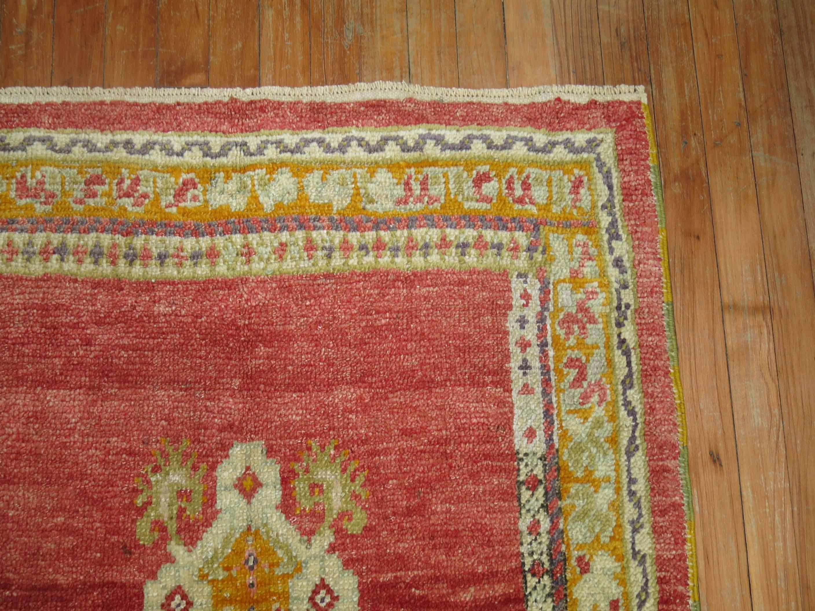A colorful one of a kind scatter size early 20th century antique Turkish Oushak rug featuring an unusual off center medallion intentionally woven to give the rug a unique character.

Measures: 3'1'' x 4'4''.