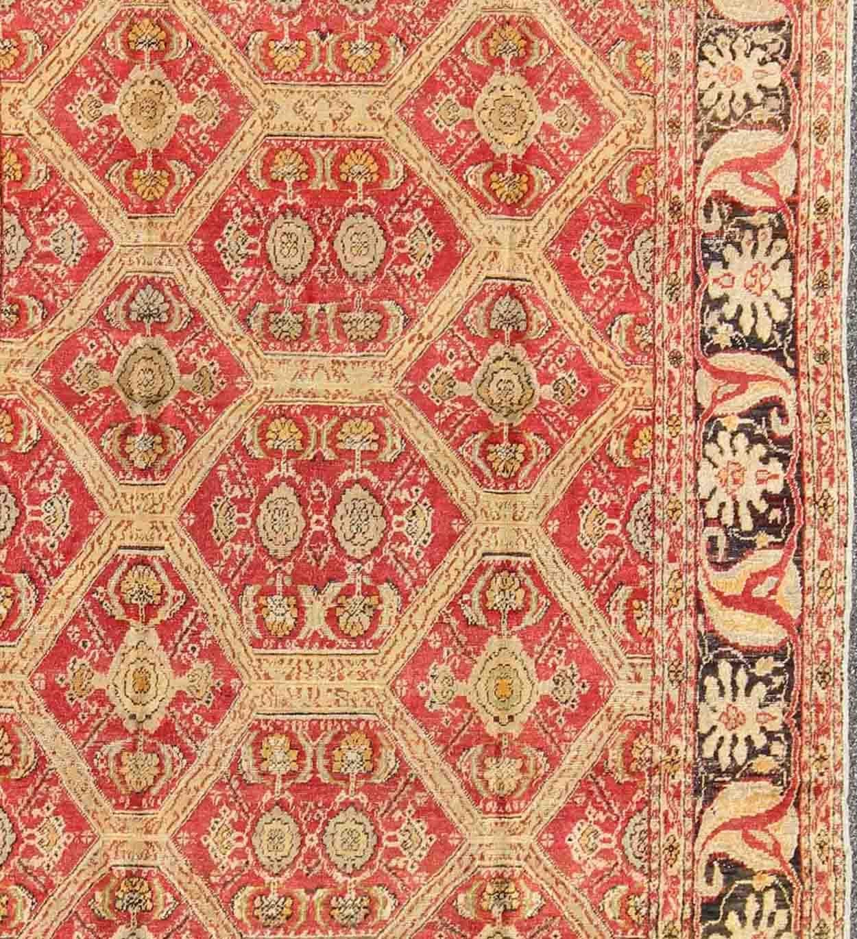 Measures: 6'6'' x 8'8''.

This magnificent Turkish rug displays a glorious coloration paired with superlative all-over sub-geometric design. The delightful hues of red and brown work together to form a rich palette of contrasting colors while the