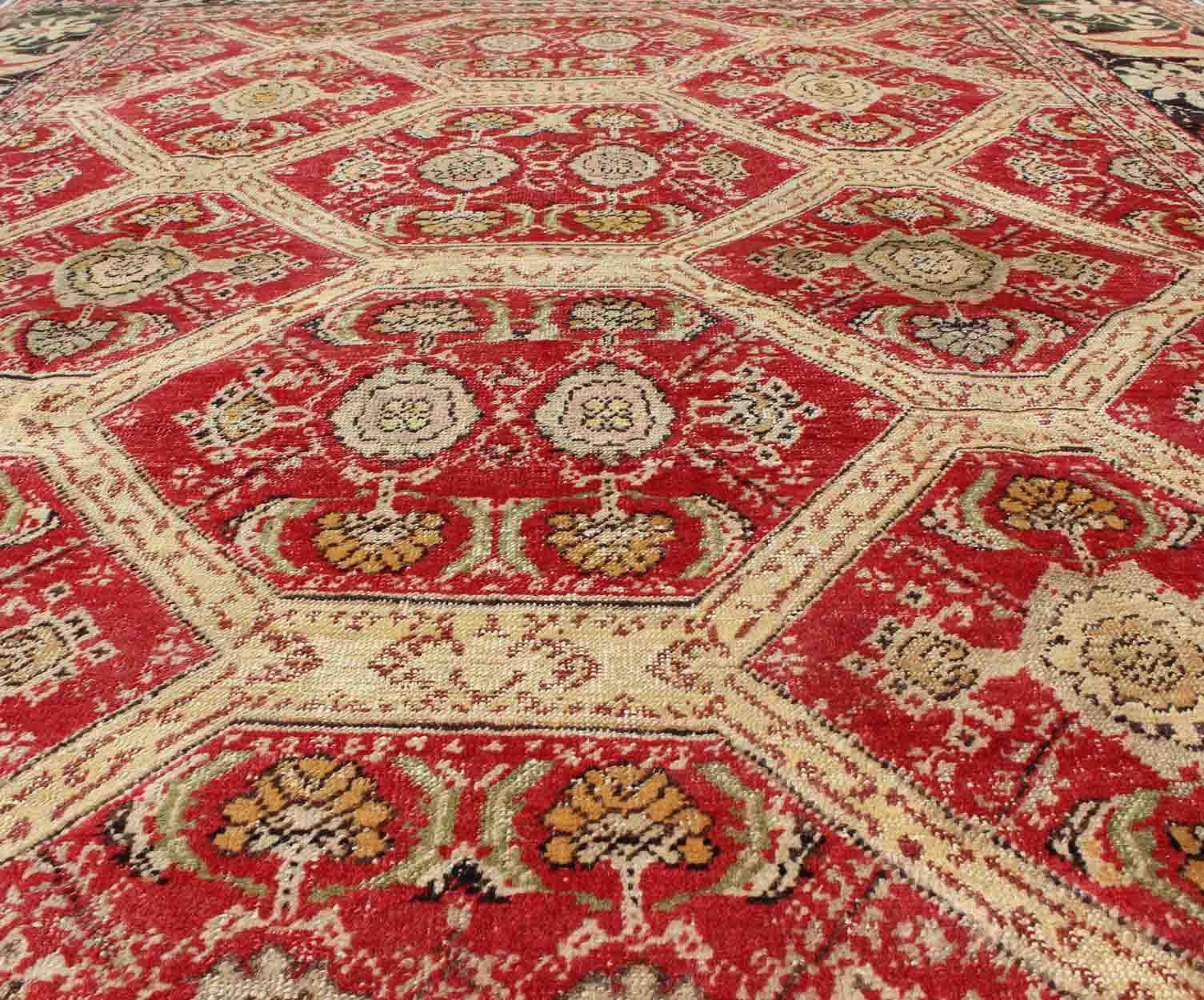Wool Antique Turkish Oushak Rug with Paisley Border and over All Tribal Design For Sale