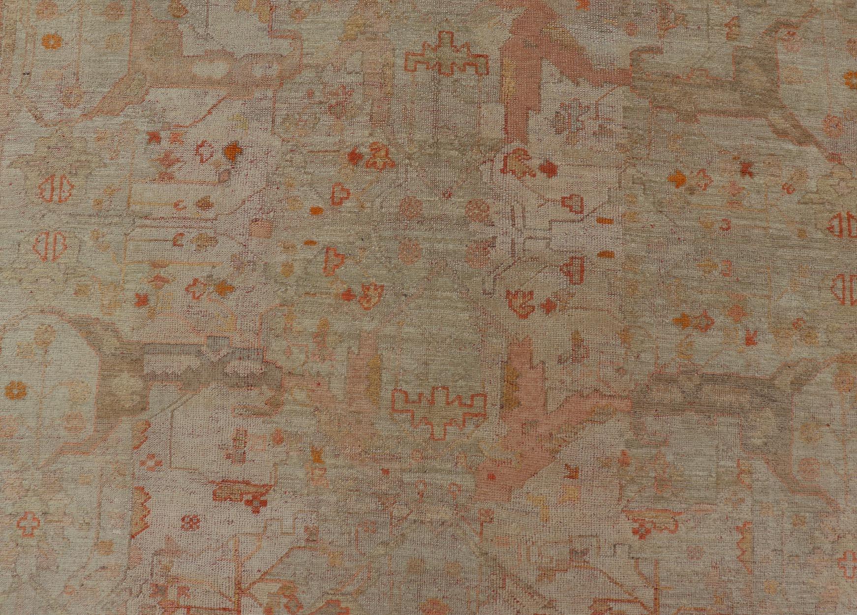 Measures: 9'9 x 12'10 
Antique Turkish Oushak Rug with Pastel Field and Subtle Terracotta 9'9 x 12'10. Keivan Woven Arts / Rug/CHRT-2, country of origin / type: Turkey / Oushak, circa 1900.

This antique Turkish Oushak rug offers a serene, aged