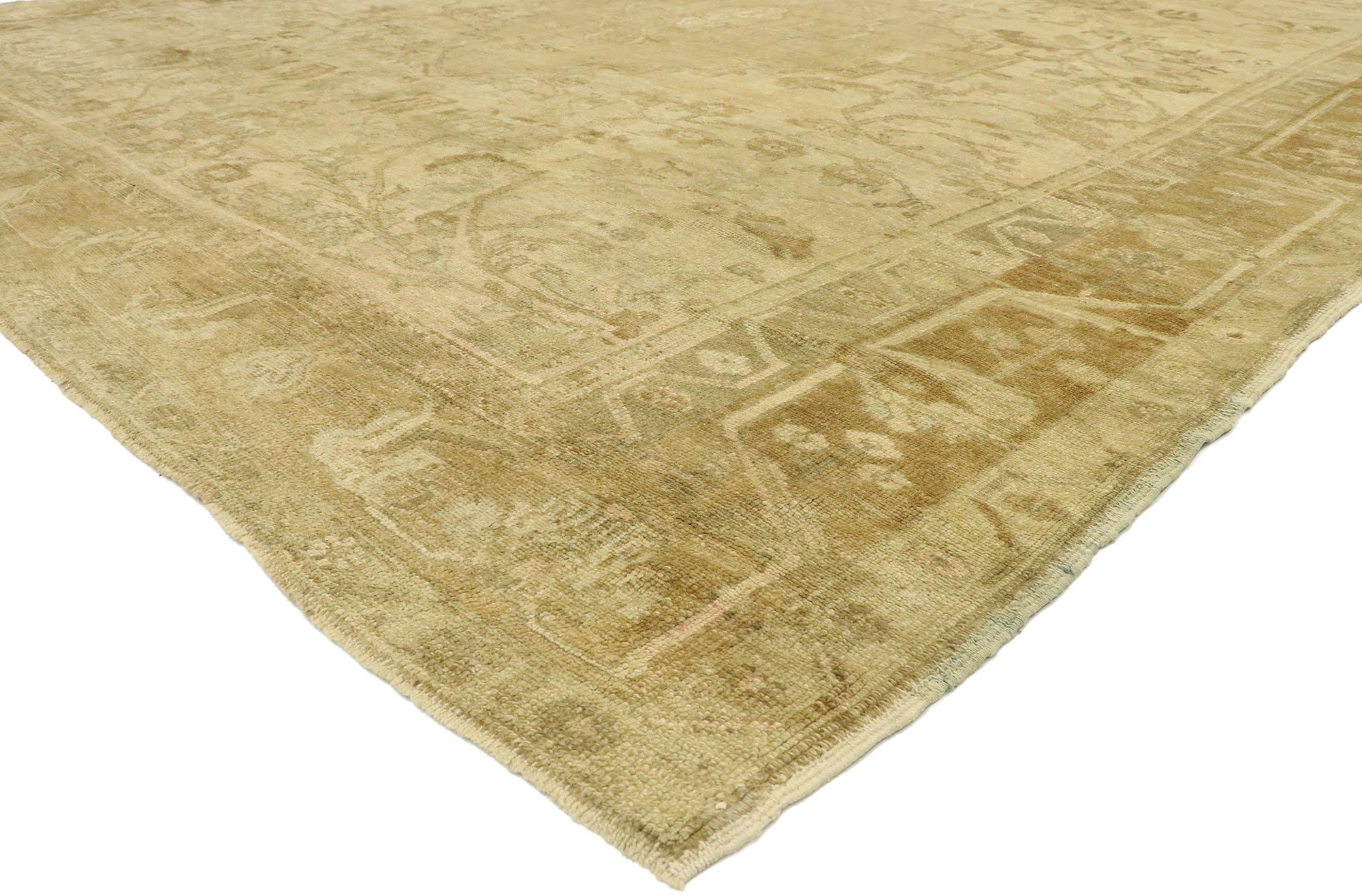 76602, antique Turkish Oushak rug with rustic French cottage style. Effortless beauty and feminine connotations meet soft, bespoke vibes with French cottage style in this hand knotted wool antique Turkish Oushak rug. The antique washed field