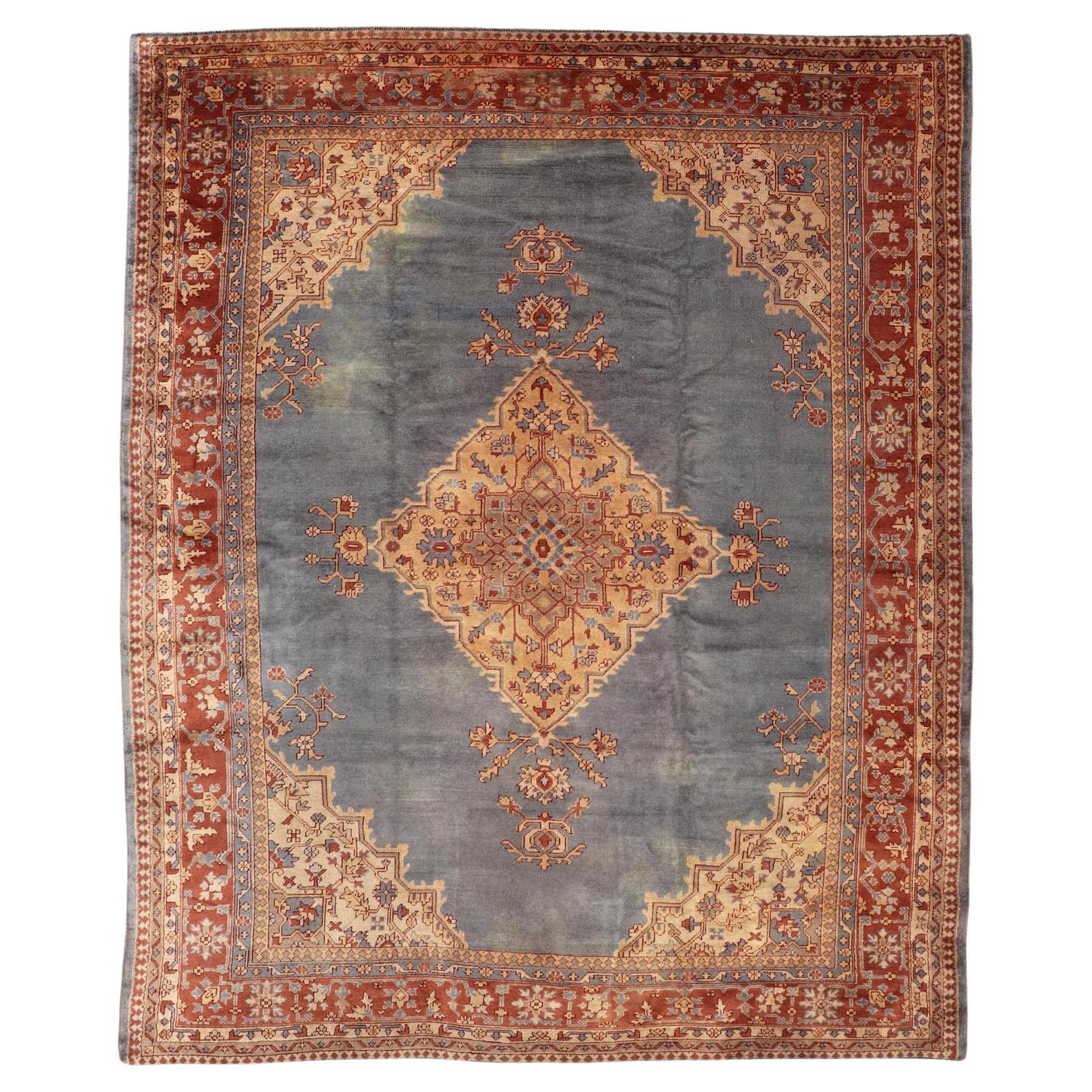 Antiker türkischer Oushak-Teppich mit schieferblauem Feld und brauner Bordüre 10'10 x 14'0