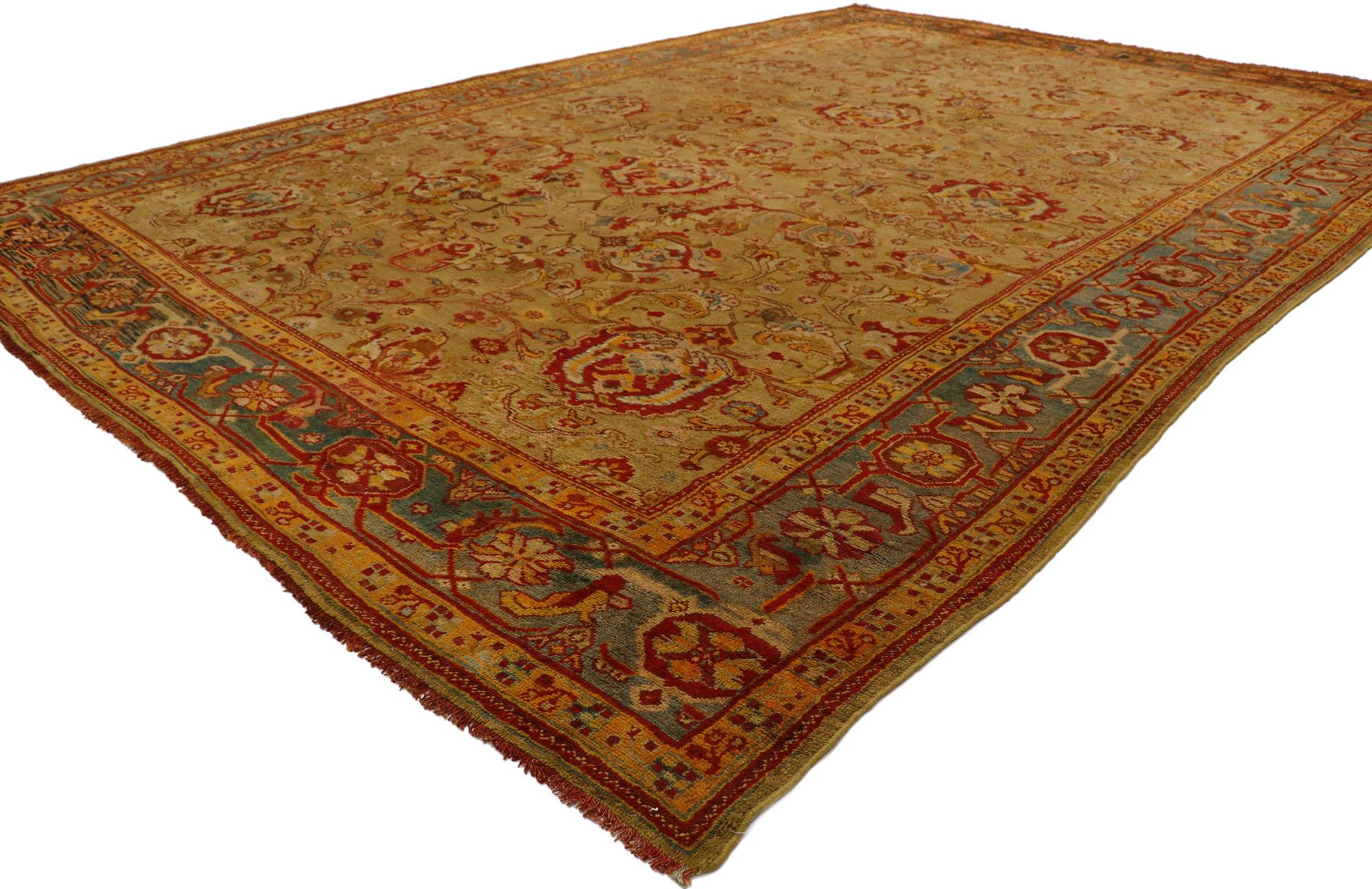 77550, antique Turkish Oushak rug with warm and rustic Mediterranean style. Displaying well-balanced symmetry and a simple design aesthetic, this hand knotted wool antique Turkish Oushak rug beautifully embodies warm Mediterranean style with rustic