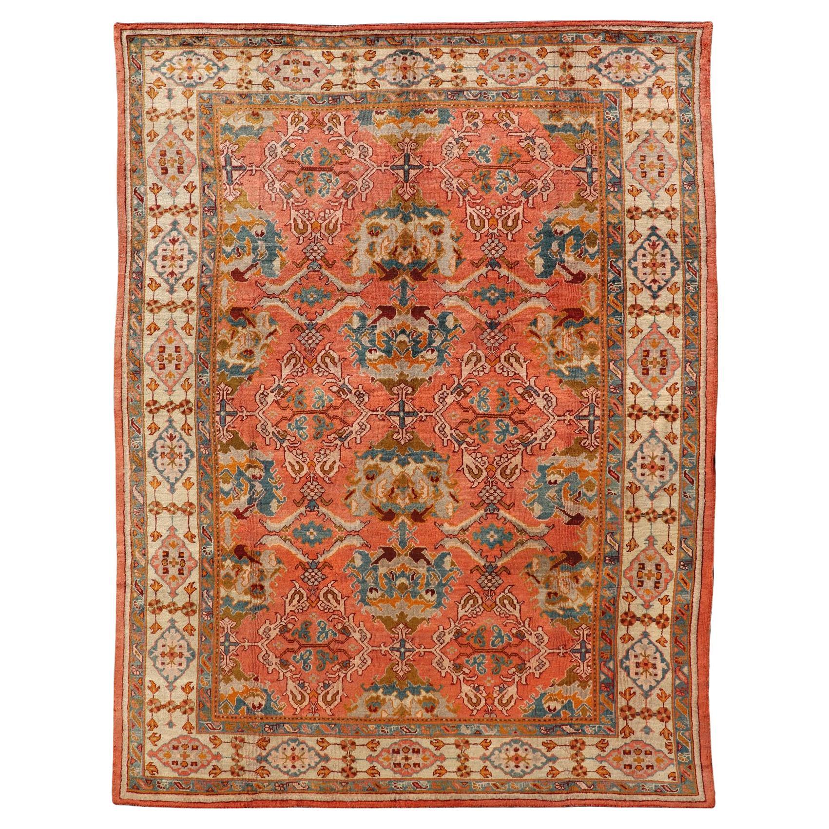 Tapis turc antique Oushak avec des accents corail, ivoire et sarcelle 10'9 x 14'7