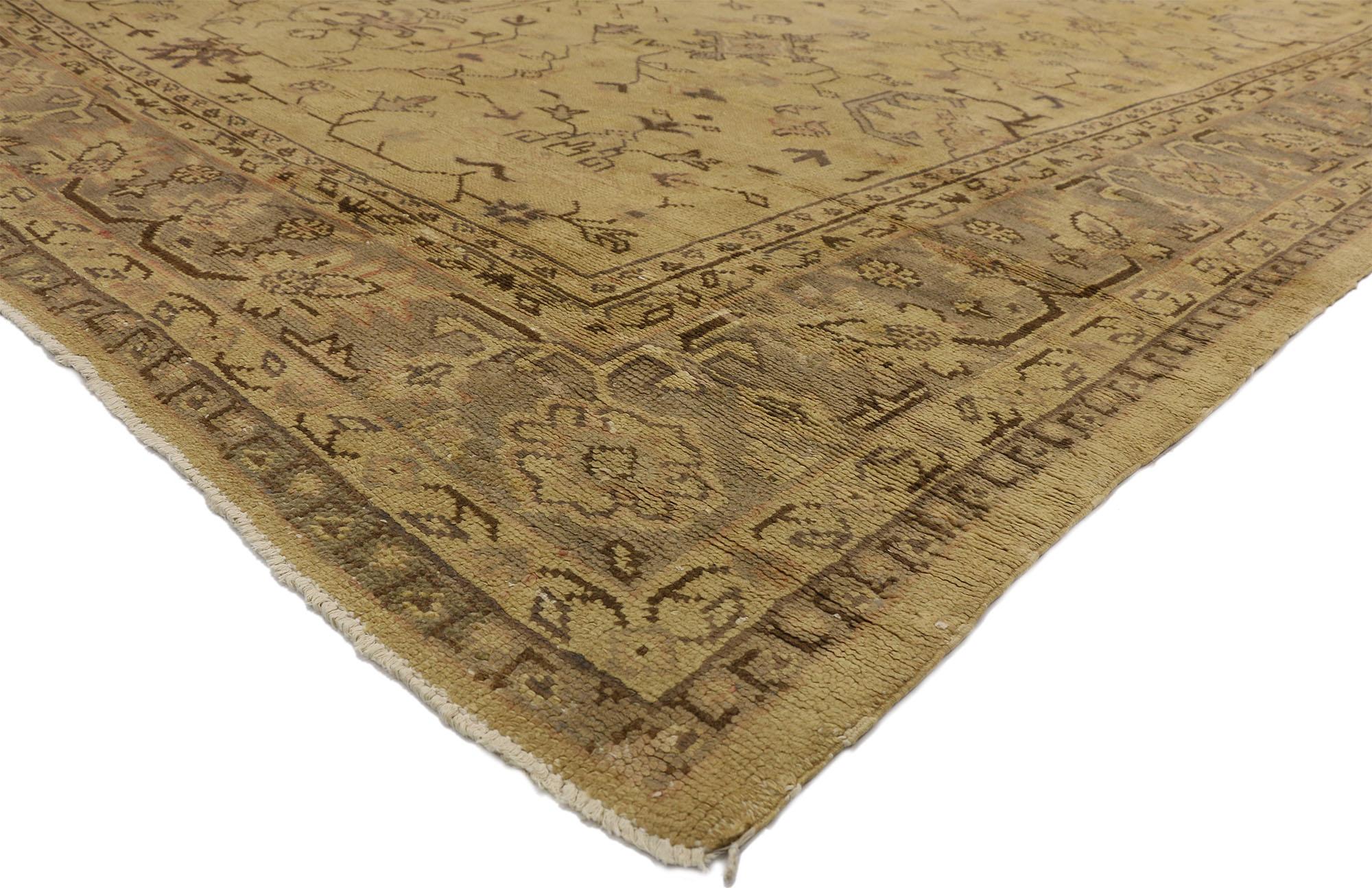 71497, antique Turkish Oushak rug with warm rustic Tuscan style 11'04 x 14'07. Warm and inviting combined with a timeless design, this hand knotted wool antique Turkish Oushak rug beautifully embodies rustic Tuscan style. The abrashed tan field is
