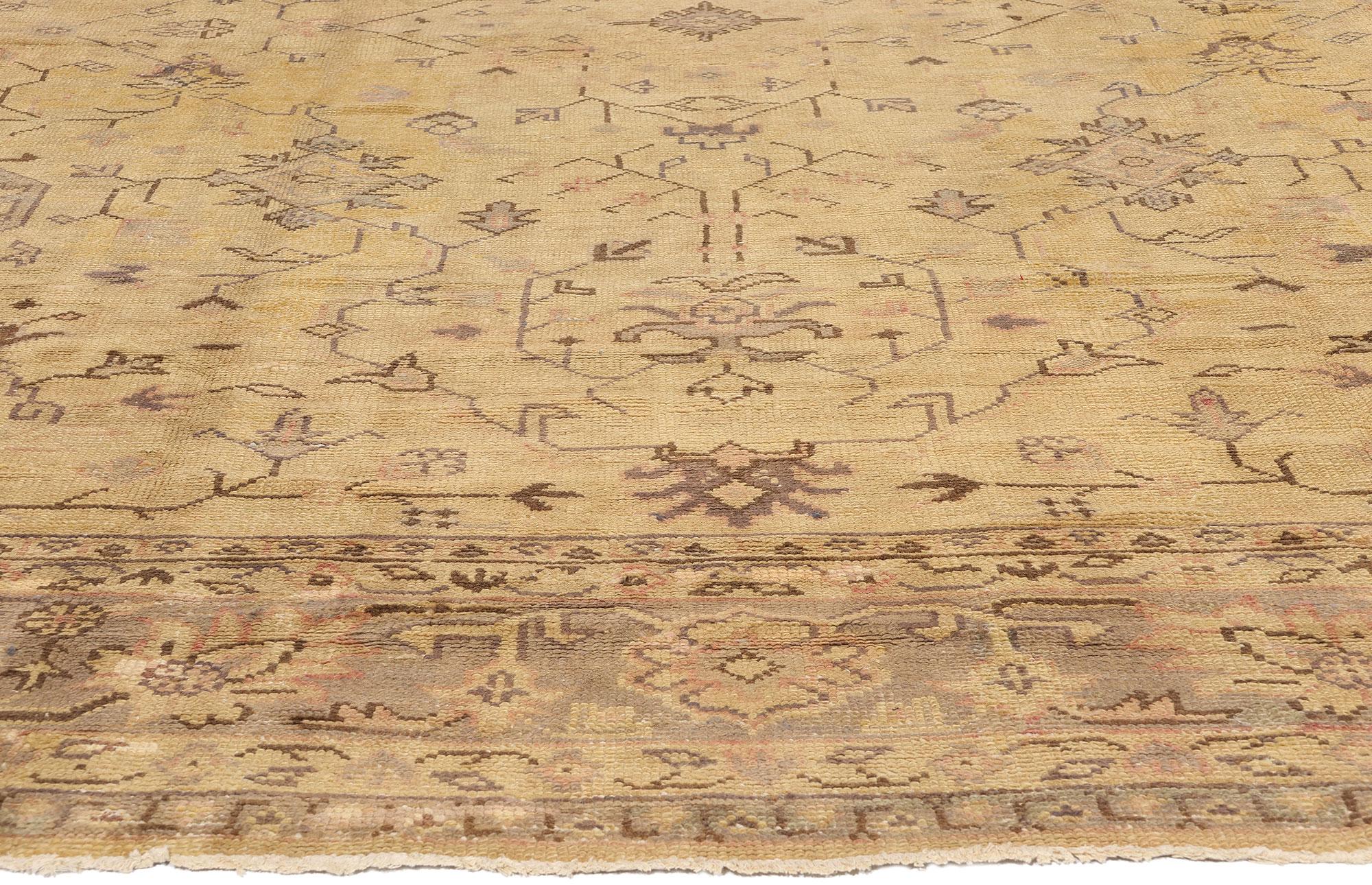 71497 Late 19th Century Antique Turkish Oushak Rug, 11'04 x 14'07. Bathed in the soft glow of time, this hand knotted wool Late 19th Century antique Turkish Oushak rug exudes an enchanting warmth, its golden hues whispering the stories of Anatolia’s