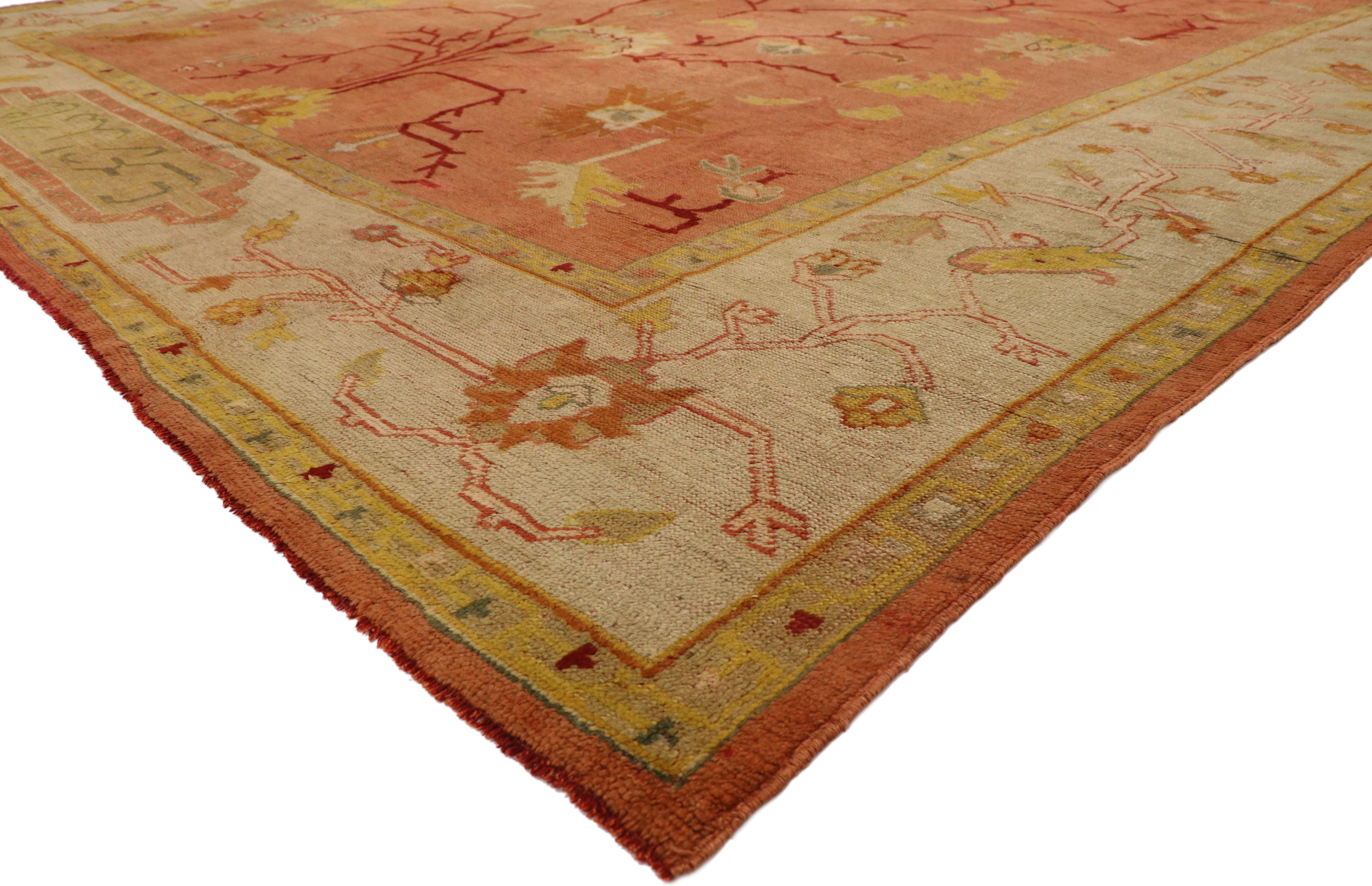 77092, antique Turkish Oushak Rug with with tree of life design and Mediterranean style. Showcasing a directional layout and beguiling beauty, this hand knotted wool antique Turkish Oushak rug imparts a sense of warmth and welcomed informality.It