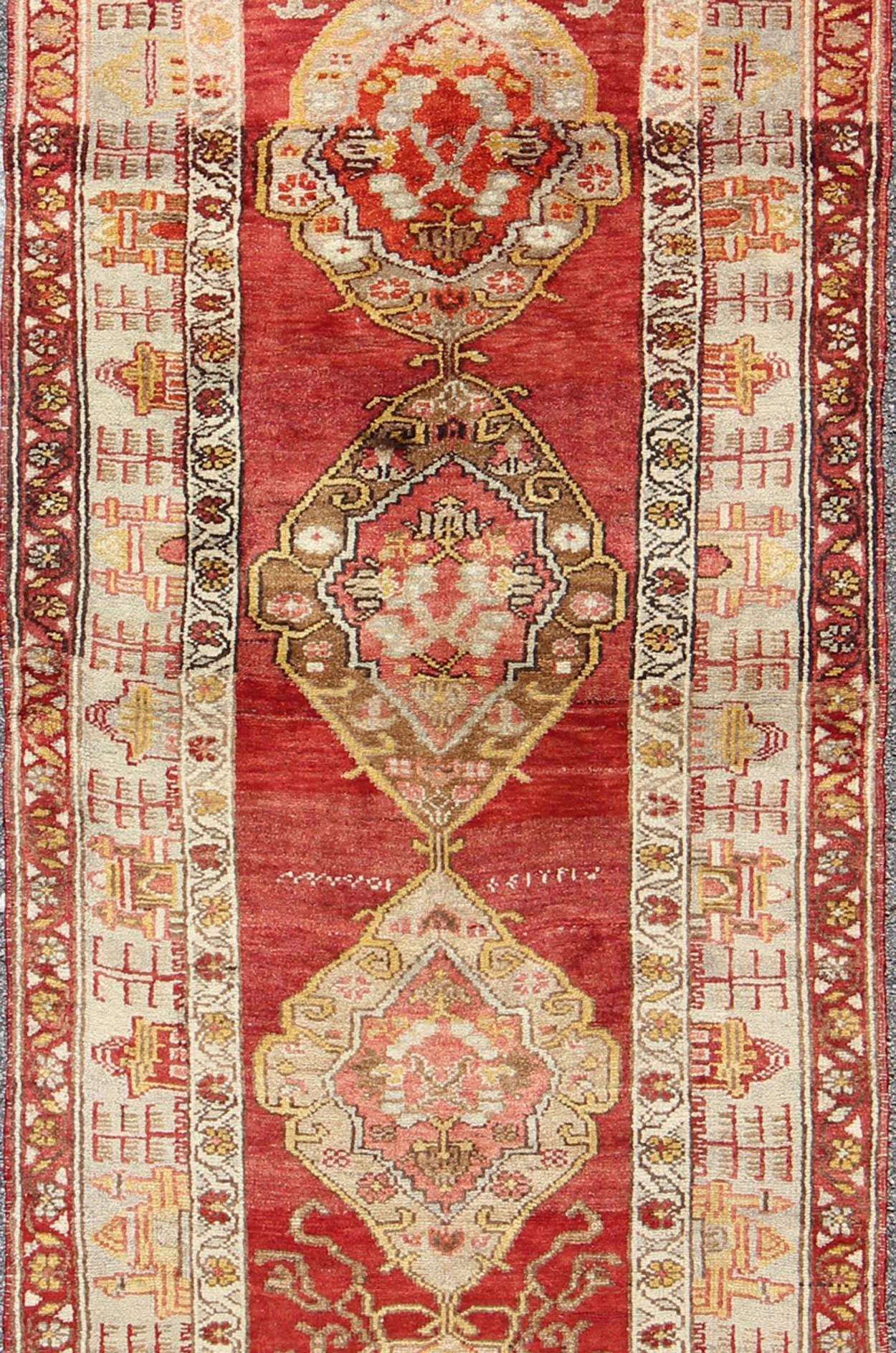 Antique Turkish Oushak Runner In Red Background with Neutral Medallions In Good Condition For Sale In Atlanta, GA