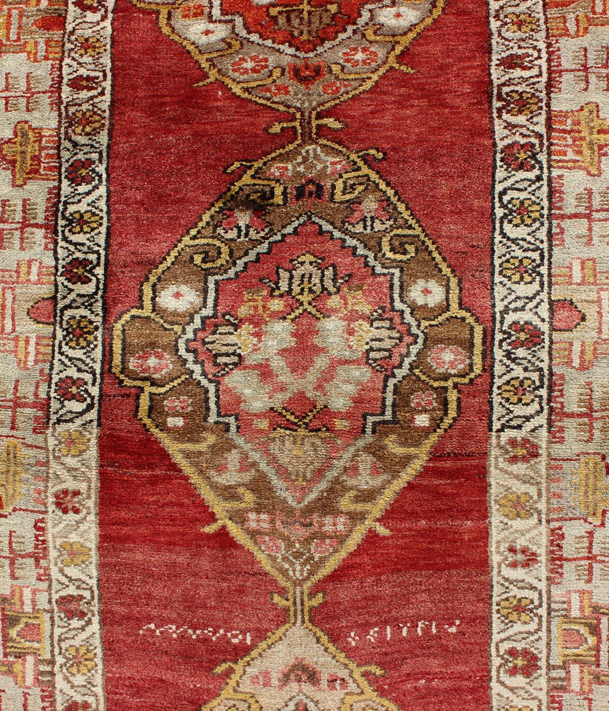 20th Century Antique Turkish Oushak Runner In Red Background with Neutral Medallions For Sale