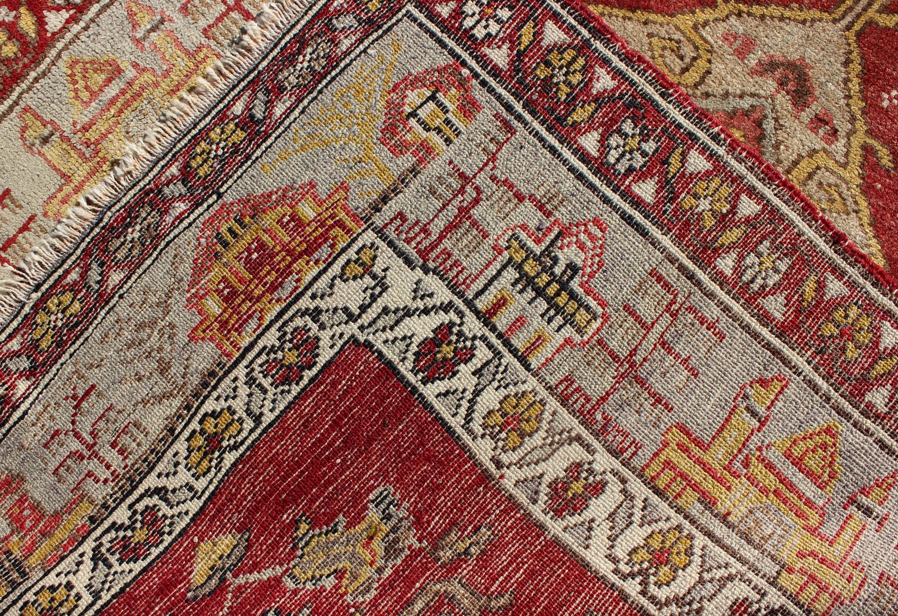 Antique Turkish Oushak Runner In Red Background with Neutral Medallions For Sale 1