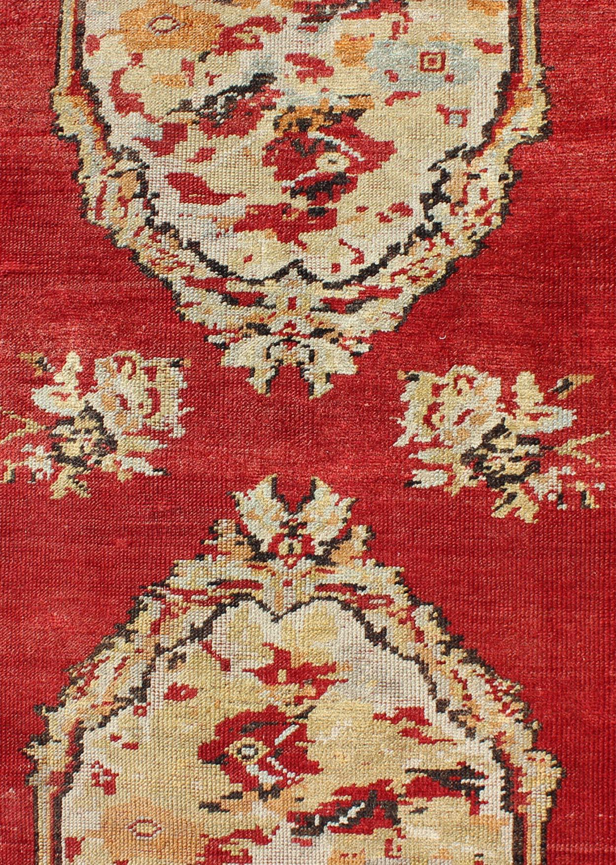 20th Century Antique Turkish Oushak Runner With European Design in Red, Brown and Green For Sale