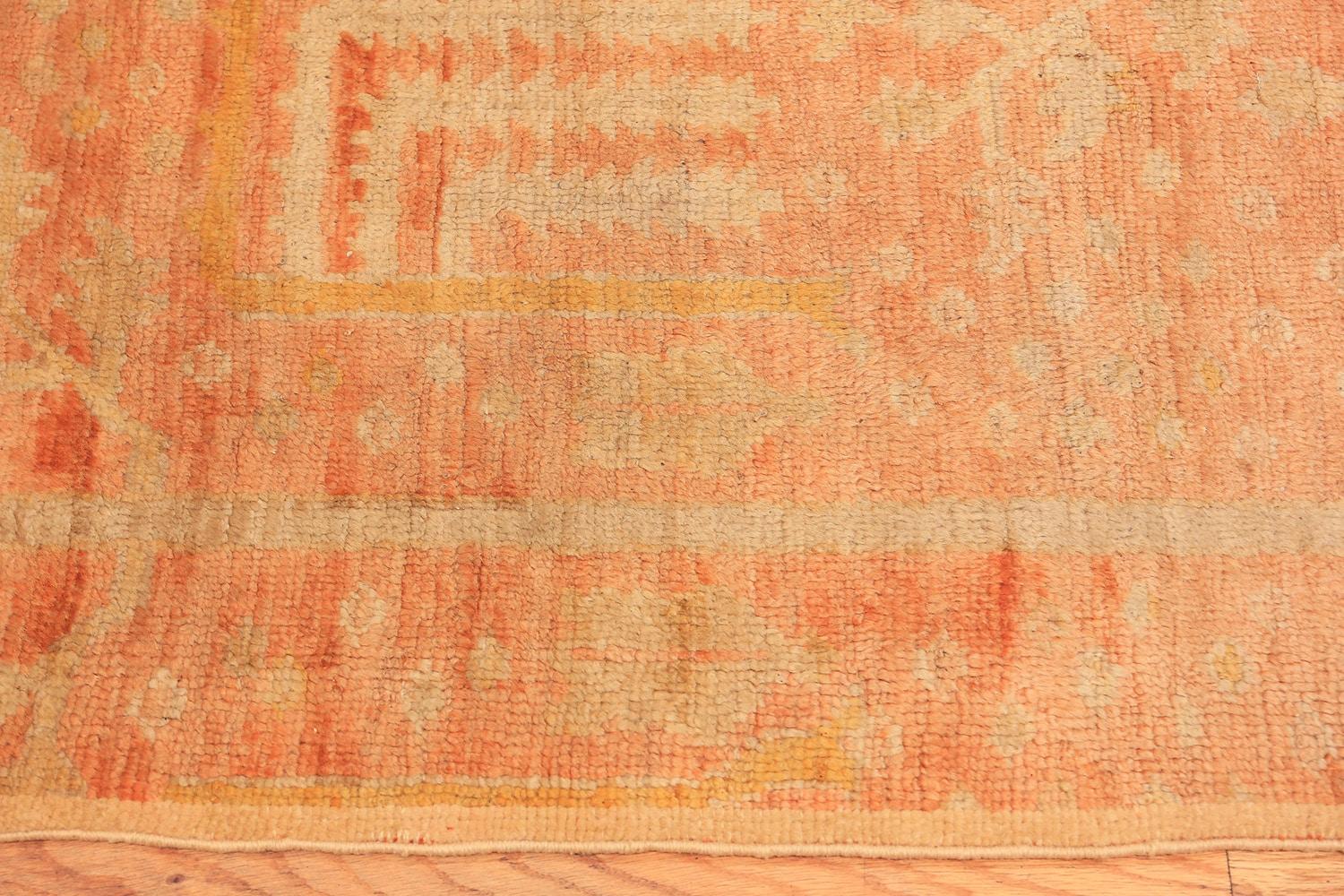 A beautifully decorative and warm antique Turkish Oushak runner rug, country of origin / rug type: antique Turkish rug, date: circa 1900, size: 2 ft 4 in x 15 ft 10 in (0.71 m x 4.83 m).