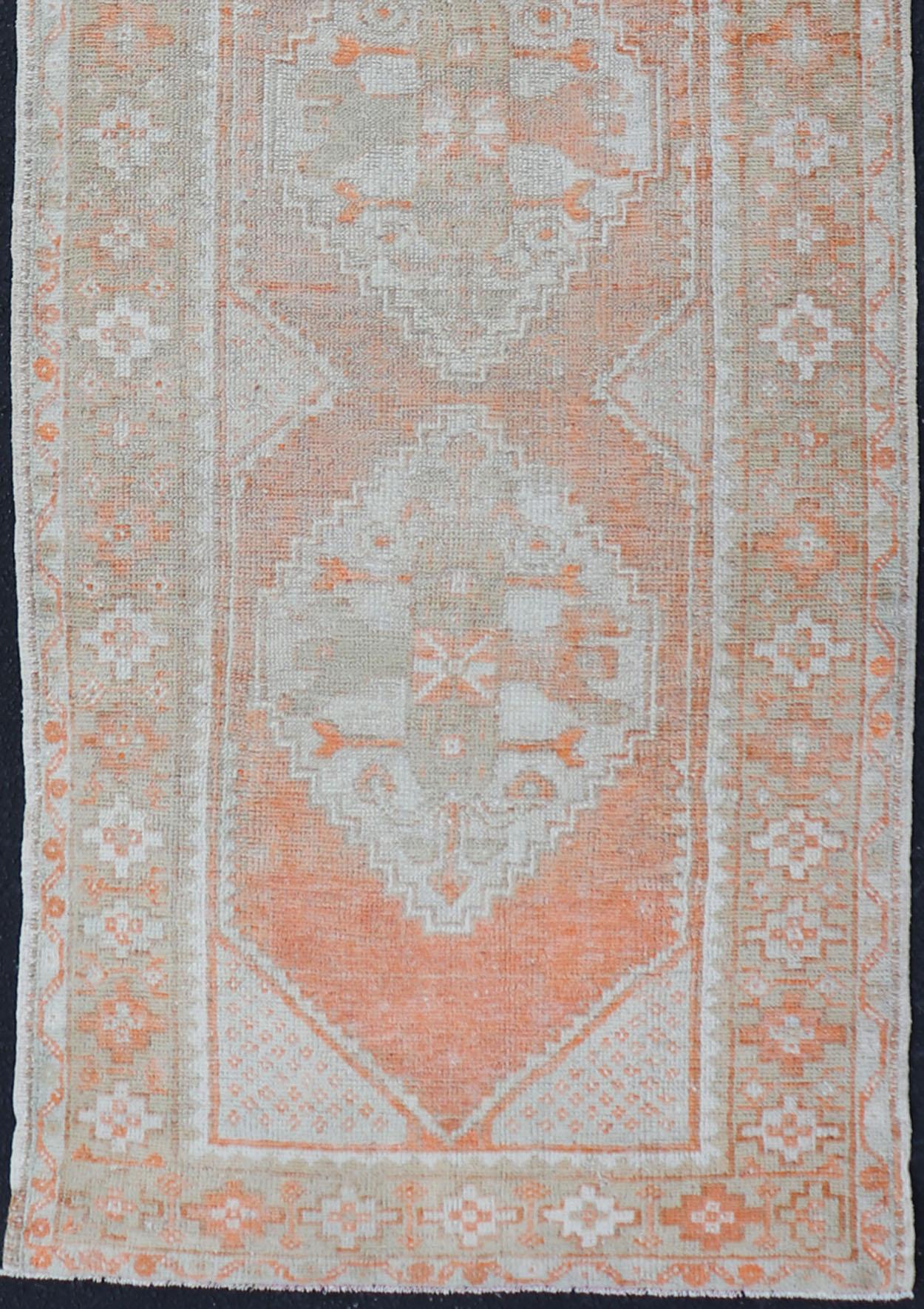 Hand-Knotted Antique Turkish Oushak Runner with Diamond Medallions and Floral Motifs For Sale