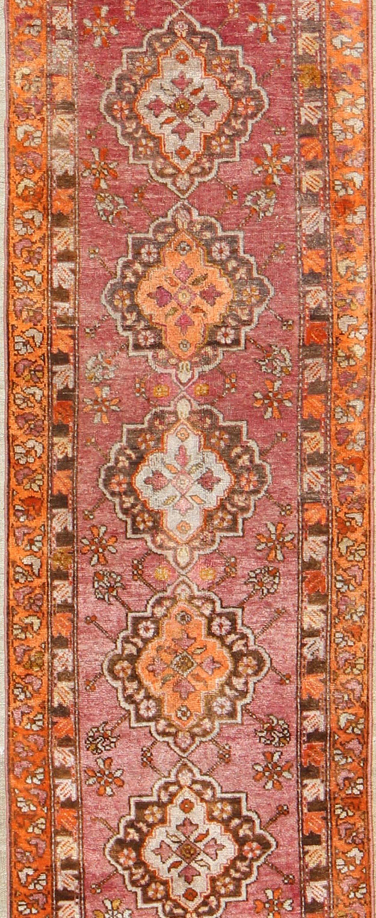 Hand-Knotted Antique Turkish Oushak Runner with Layered Floral Medallions and Ornate Borders For Sale