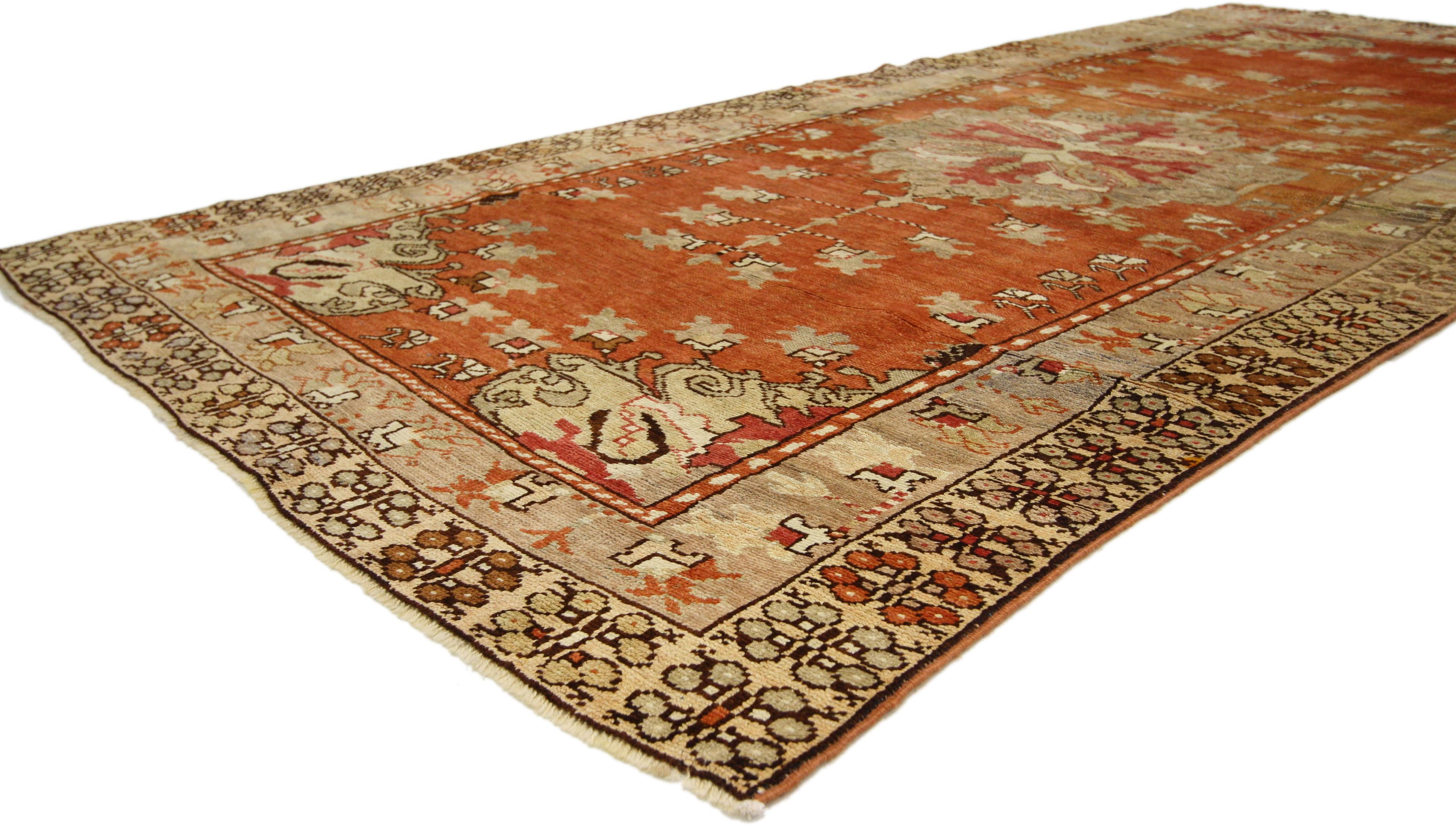 50634 Antique Turkish Oushak Runner with Rustic Cottage Style, Wide Hallway Runner. This hand-knotted wool antique Turkish Oushak runner with Rustic Cottage style features a center medallion with a tree of life design on either end. It is enclosed