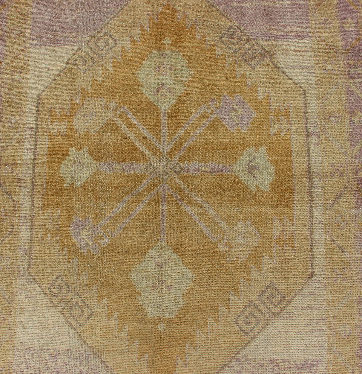 Wool Antique Turkish Oushak Runner with Three Geometric Medallions in Purple Tones For Sale