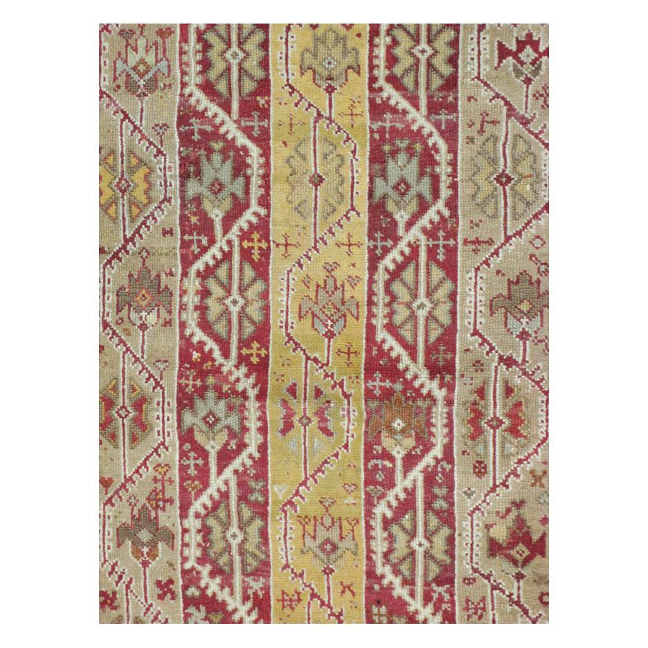 An antique Turkish Oushak room size rug in square format handmade during the early 20th century with a vertical cane design (pole design).

Measures: 11' 9