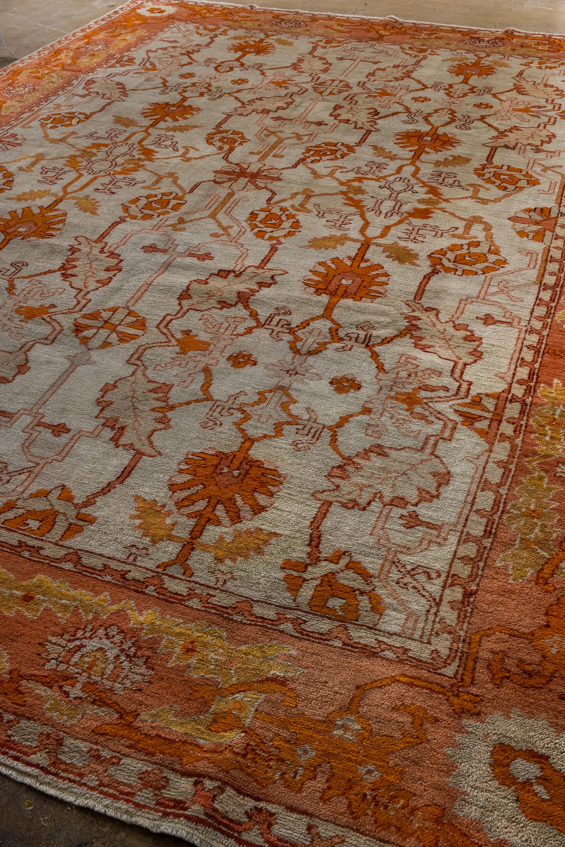 Hand-Knotted Antique Turkish Oushak with Beige Field and an Allover Palmette Design For Sale