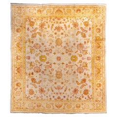 Antique Turkish Oushak with Delicate Floral Field in Soft Saffron and Ivory