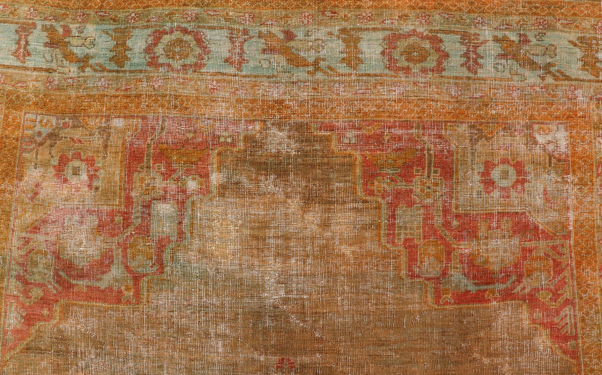  Antique Turkish Oushak With Medallion in green, Coral, L. Blue & Marigold. Keivan Woven Arts / rug / R20-1015, country of origin / type: Turkey / Oushak, circa 1900

Measures: 8'10 x 12'4 

This diverse and beautiful 1900's antique Oushak with