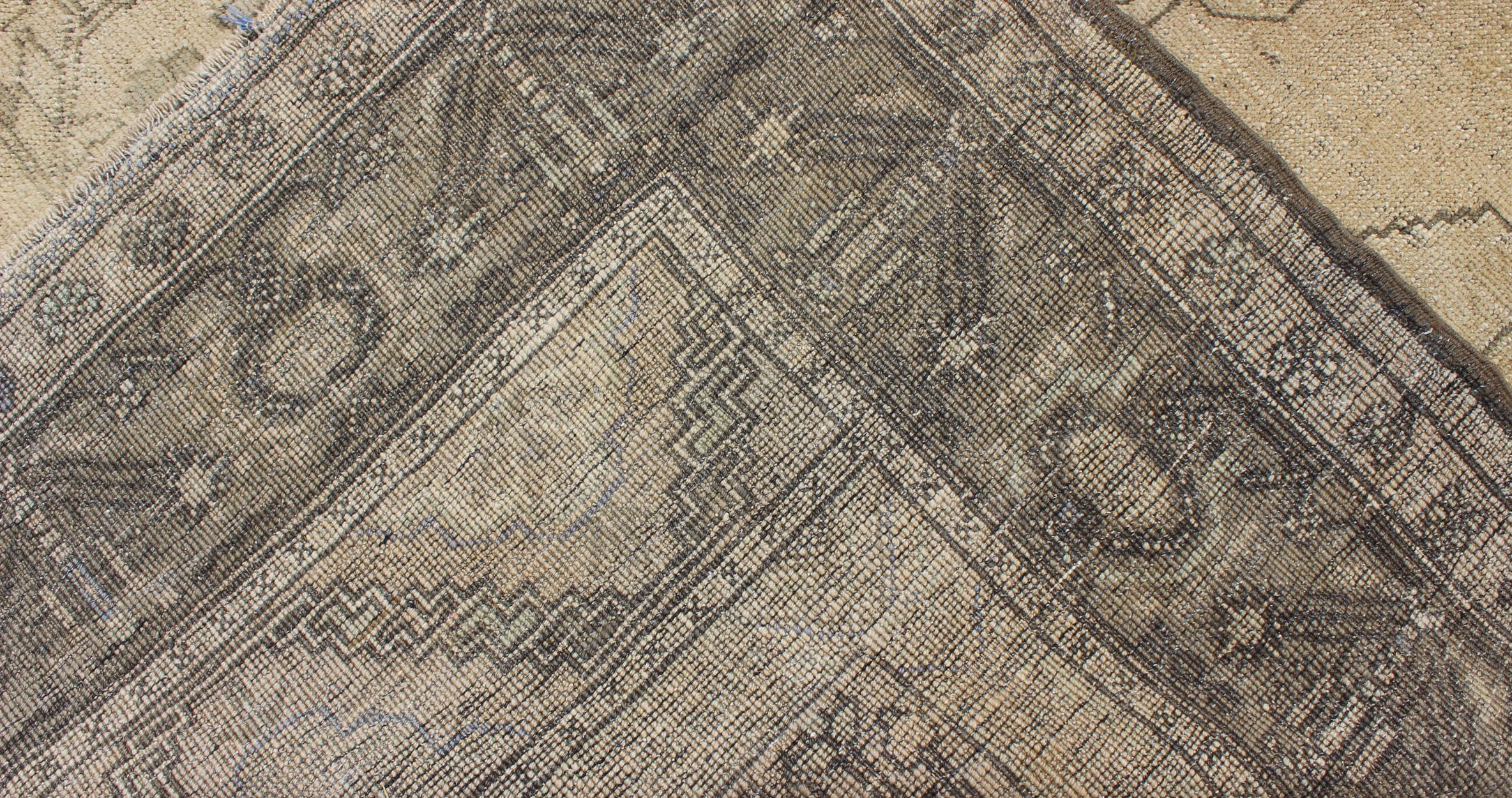 Wool Antique Turkish Oushak with Stylized Medallion Design in Muted Neutral Tones For Sale
