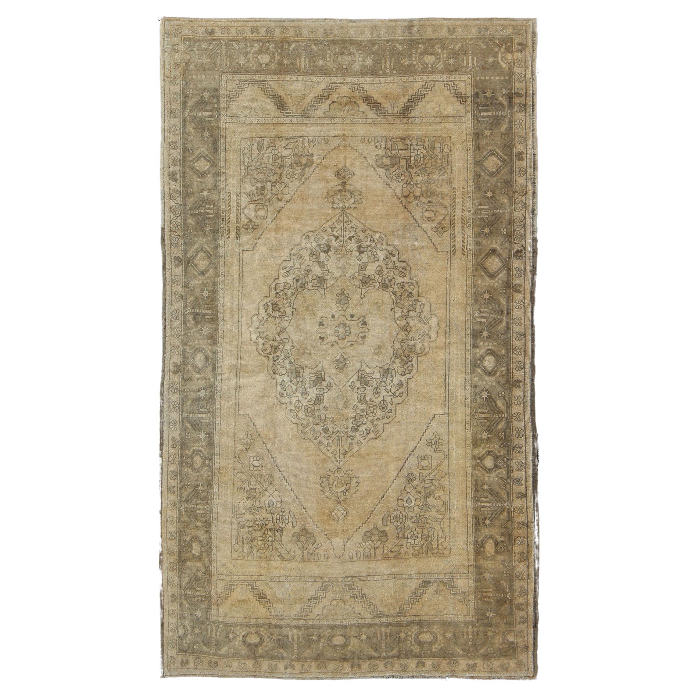 Antique Turkish Oushak with Stylized Medallion Design in Muted Neutral Tones For Sale