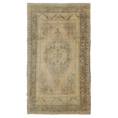 Antique Turkish Oushak with Stylized Medallion Design in Muted Neutral Tones