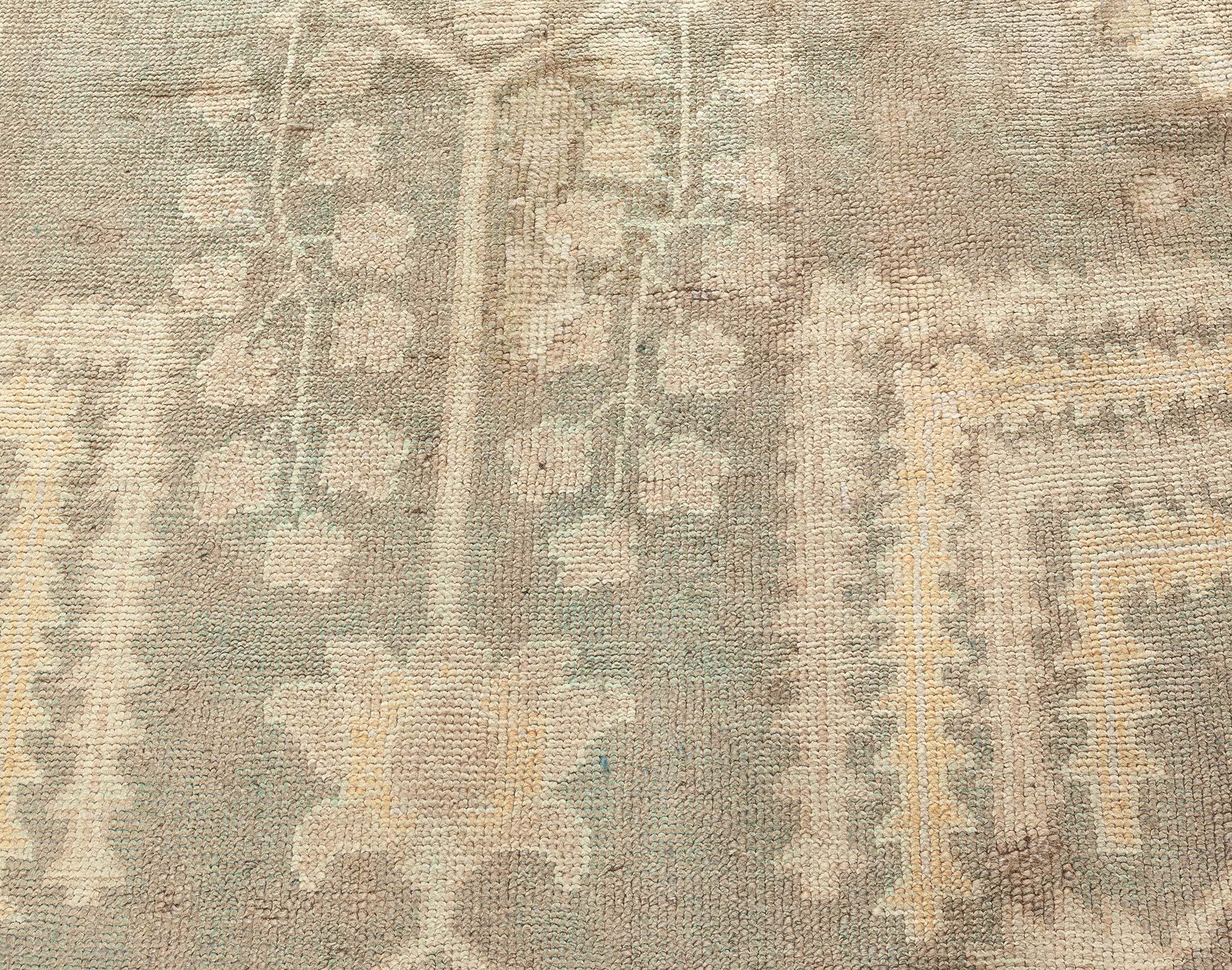 Dusty shades of yellow, beige, brown and taupe antique Turkish Oushak wool rug
Size: 14'0