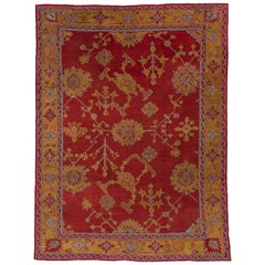 Tapis turc ancien d'Oushak rouge, bordures jaunes, vers les années 1910