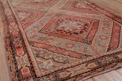 Antique Khotan Rug - Red Hues, Triangular Detailing