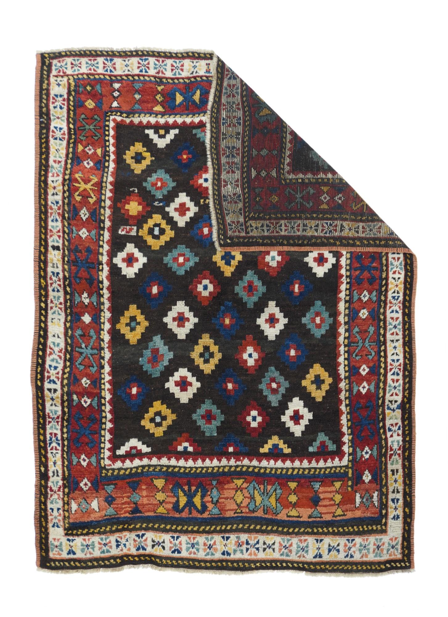Antique Southern Caucasian Tribal Rug 4'6'' x 6'2''
An example of a recently isolated southern Caucasian type. The deep brown-red field shows rough color diagonals of stepped lozenges in green, straw, cream, rust and medium blue. Abrashed red border