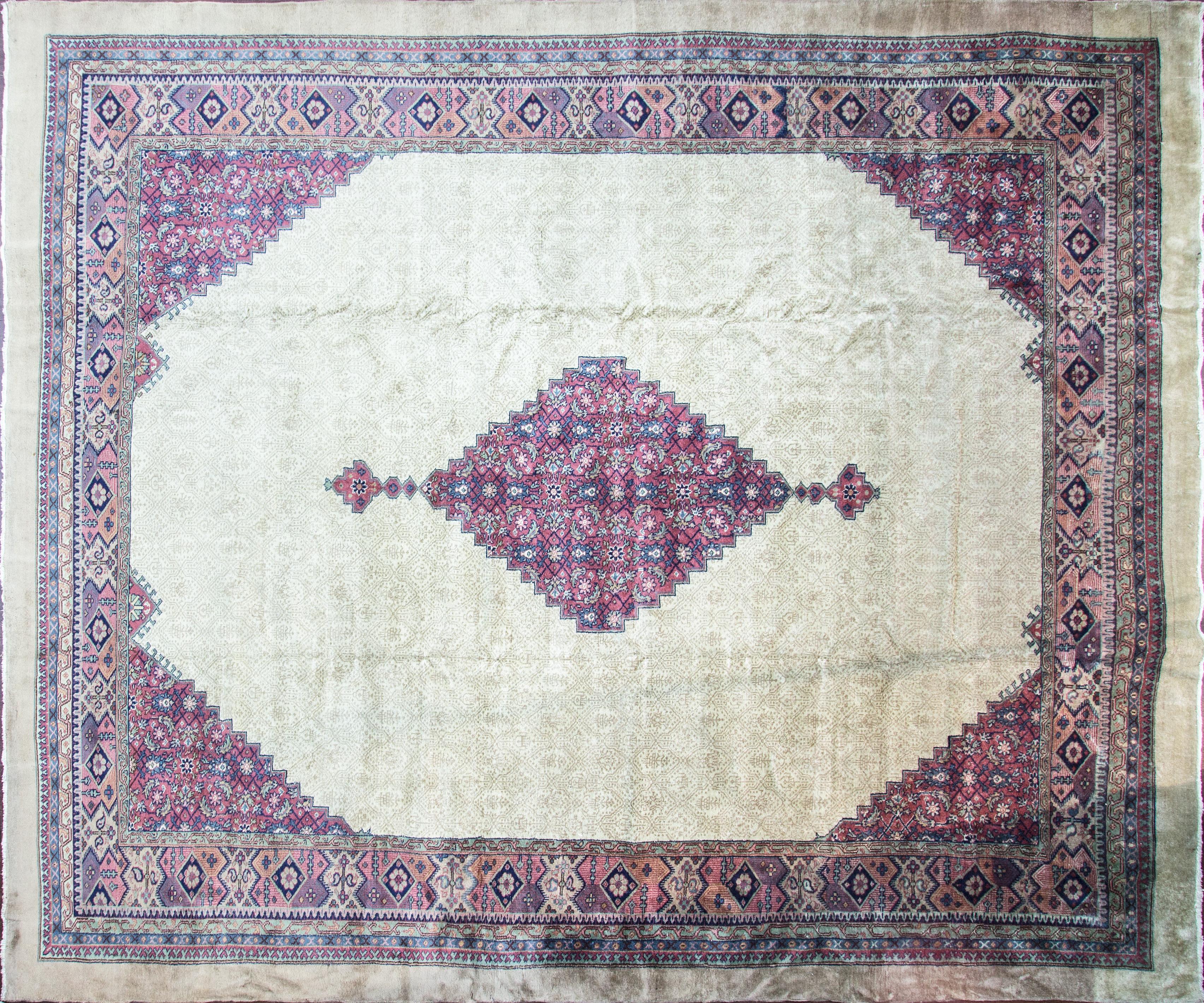 Antique Turkish Serab carpet. Measure: 12' x 14'.
Serab rugs are known mostly for their fine long rugs or runners and occasionally large room-sized rugs are also found with a characteristic camel ground and lozenge-shaped medallions, camel-colored
