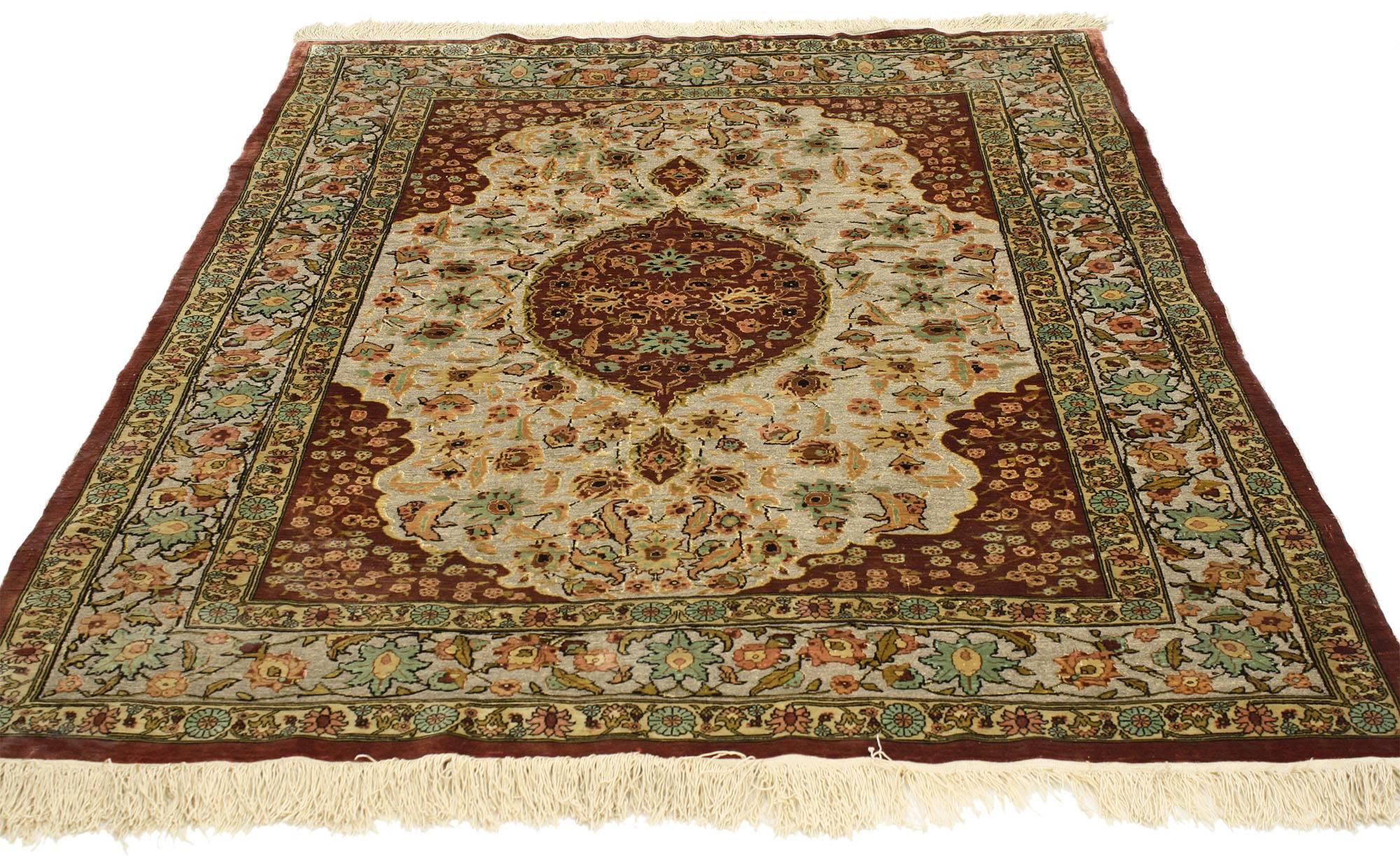 77024, this opulent antique Turkish silk and gold Hereke tapestry with flower of the seven mountains. Featuring a central medallion of cinnamon-red floating in a cut out medallion of shimmering smoky taupe. Spandrels are cinnamon echoing the central