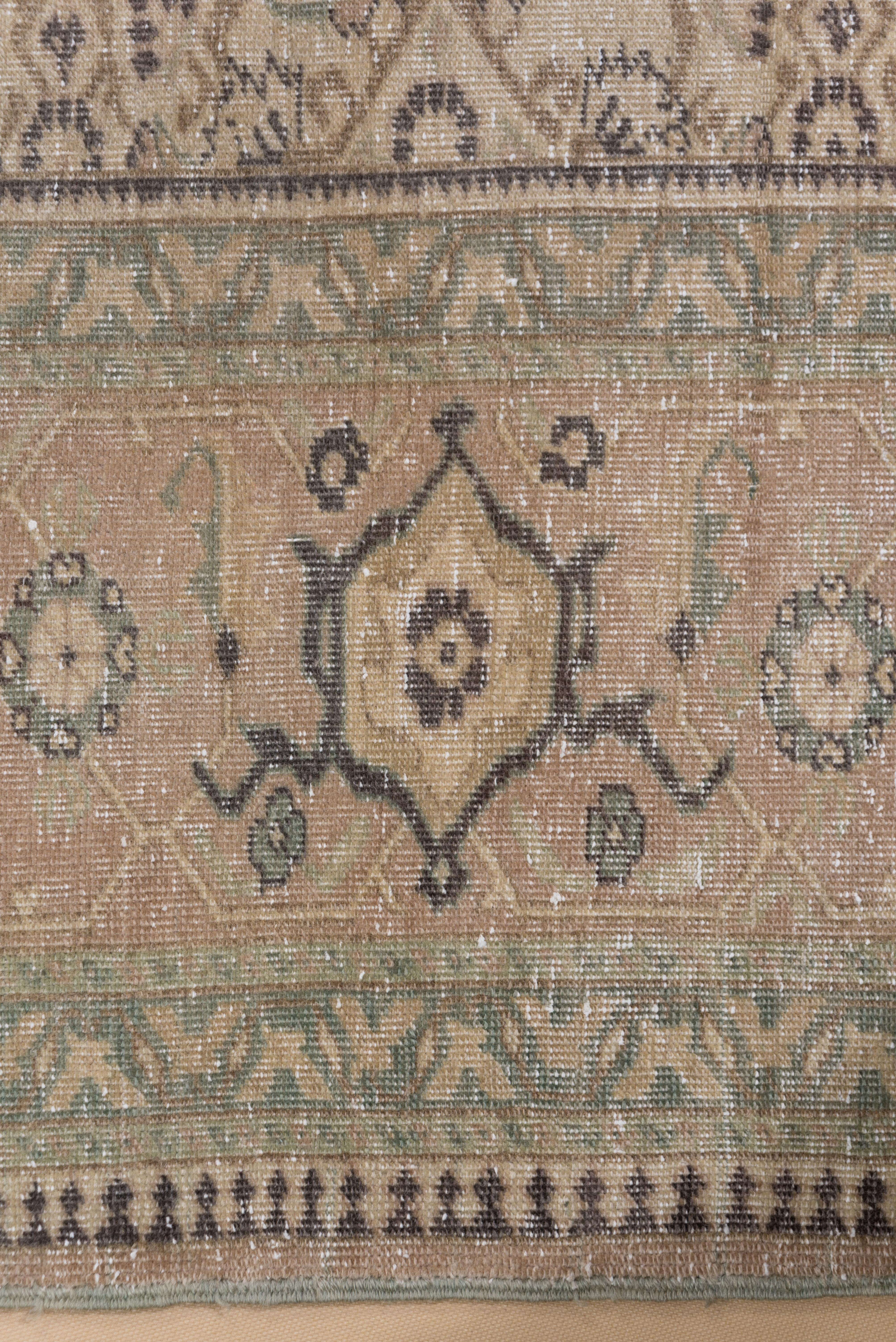 This Turkish Tabriz style Sivas carpet shows a perfectly executed small all-over Herati pattern on an eggshell ground with a wine-brown accented large scal reversing turtle border on a mauve-beige ground.