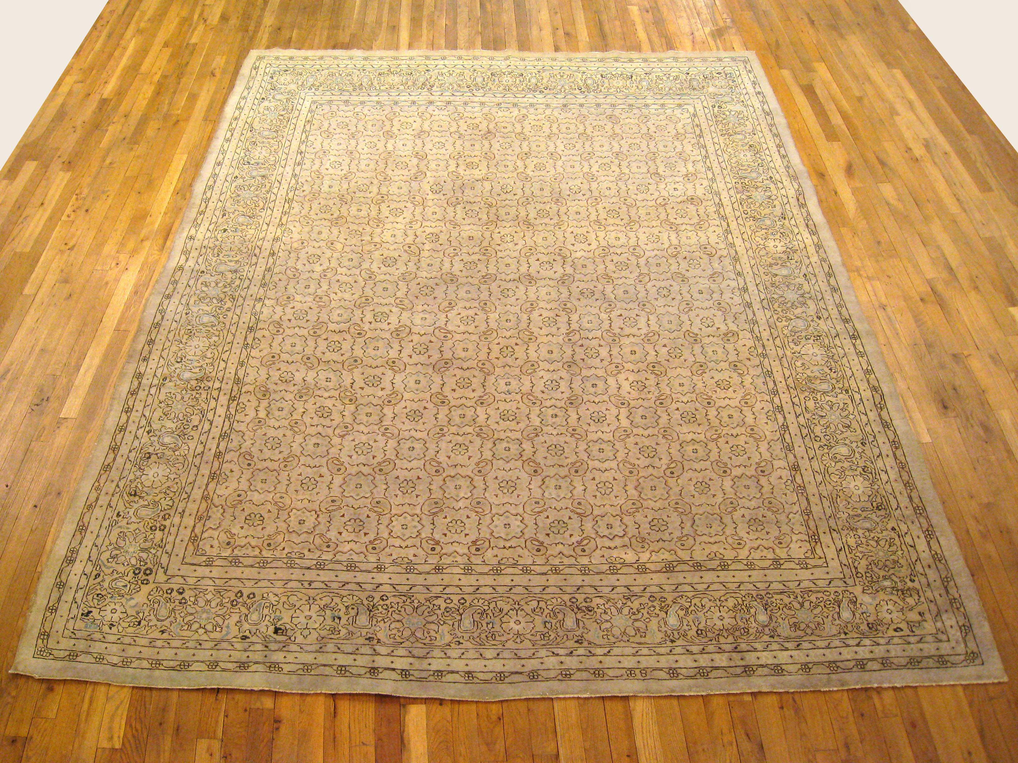 Antique Turkish Sivas rug, Room size, circa 1900

A one-of-a-kind antique Turkish Sivas Oriental Carpet, hand-knotted with soft wool pile. This beautiful hand-knotted wool rug features delicate rosettes covering a gray primary field, with an