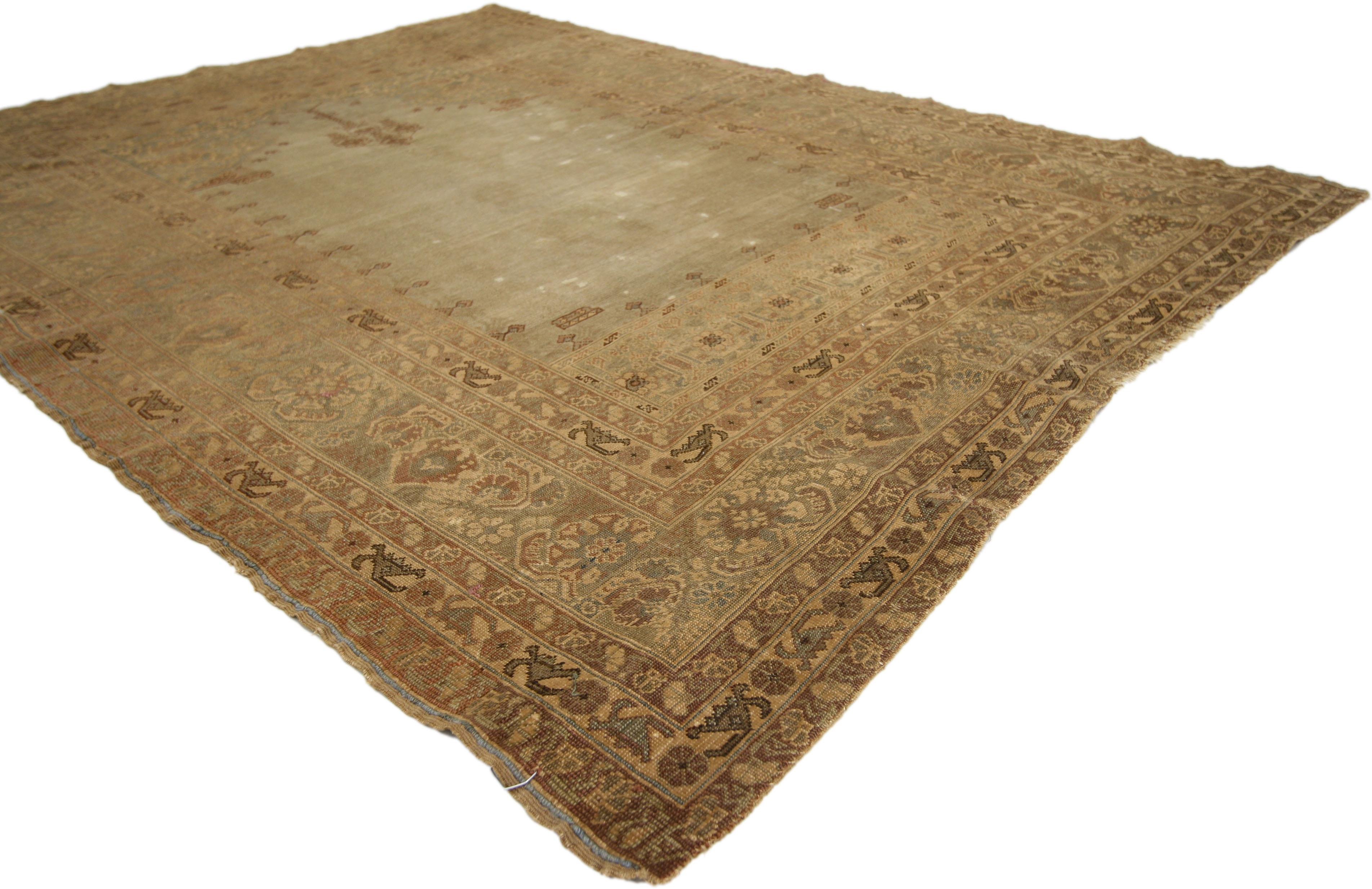 76611 Distressed Antique Turkish Sivas Prayer Rug 04’01 x 05’05. With its beguiling beauty and rustic sensibility, this hand knotted wool distressed antique Turkish Sivas prayer rug imparts a sense of warmth and welcomed informality. It features a