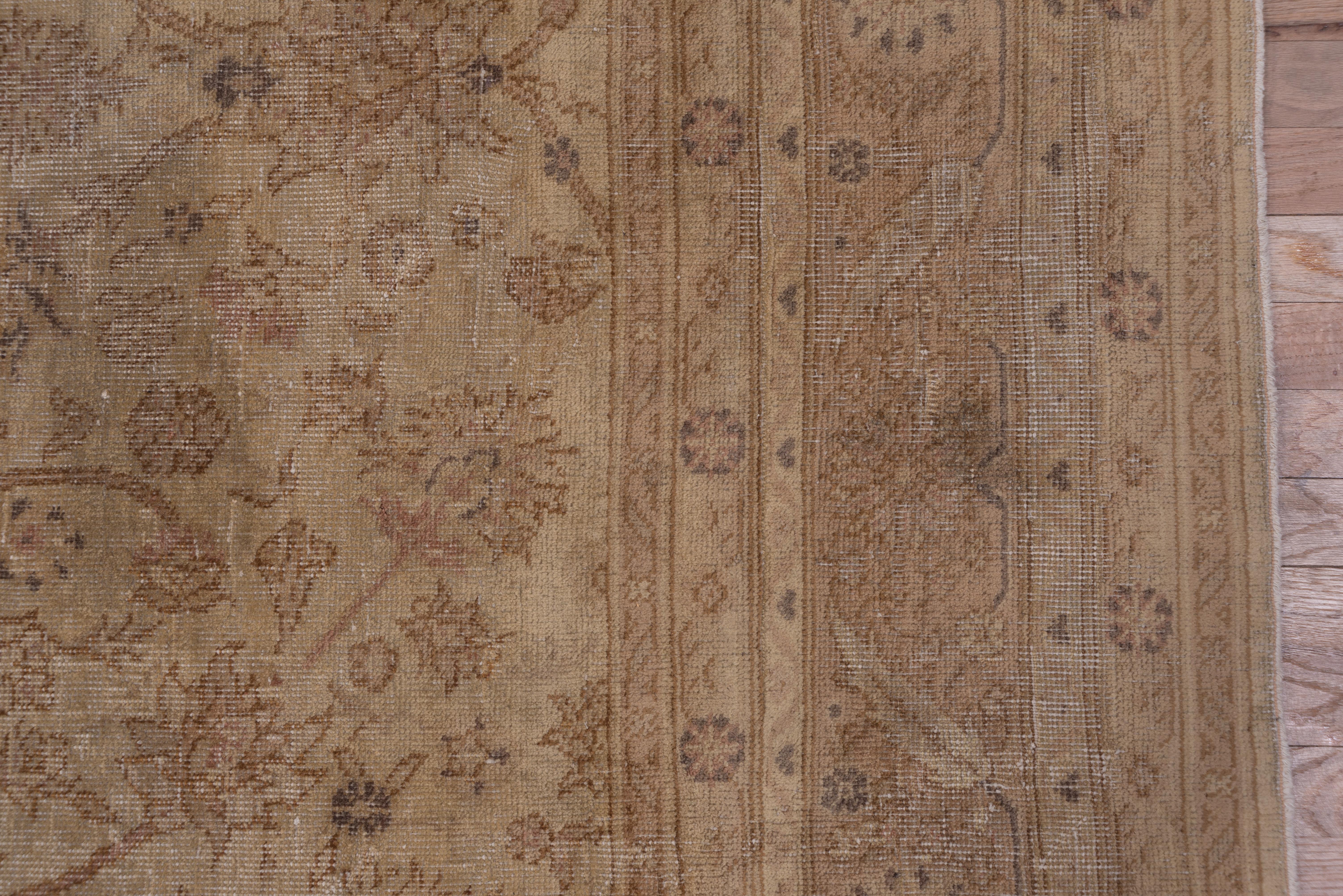 The beige field shows a centralized pattern of two layers of long rinceaux and concave diamonds decorated by a somewhat spacious design of small palmettes and related floriate elements border of rosettes and slanted barbed leaves. Brown and tan