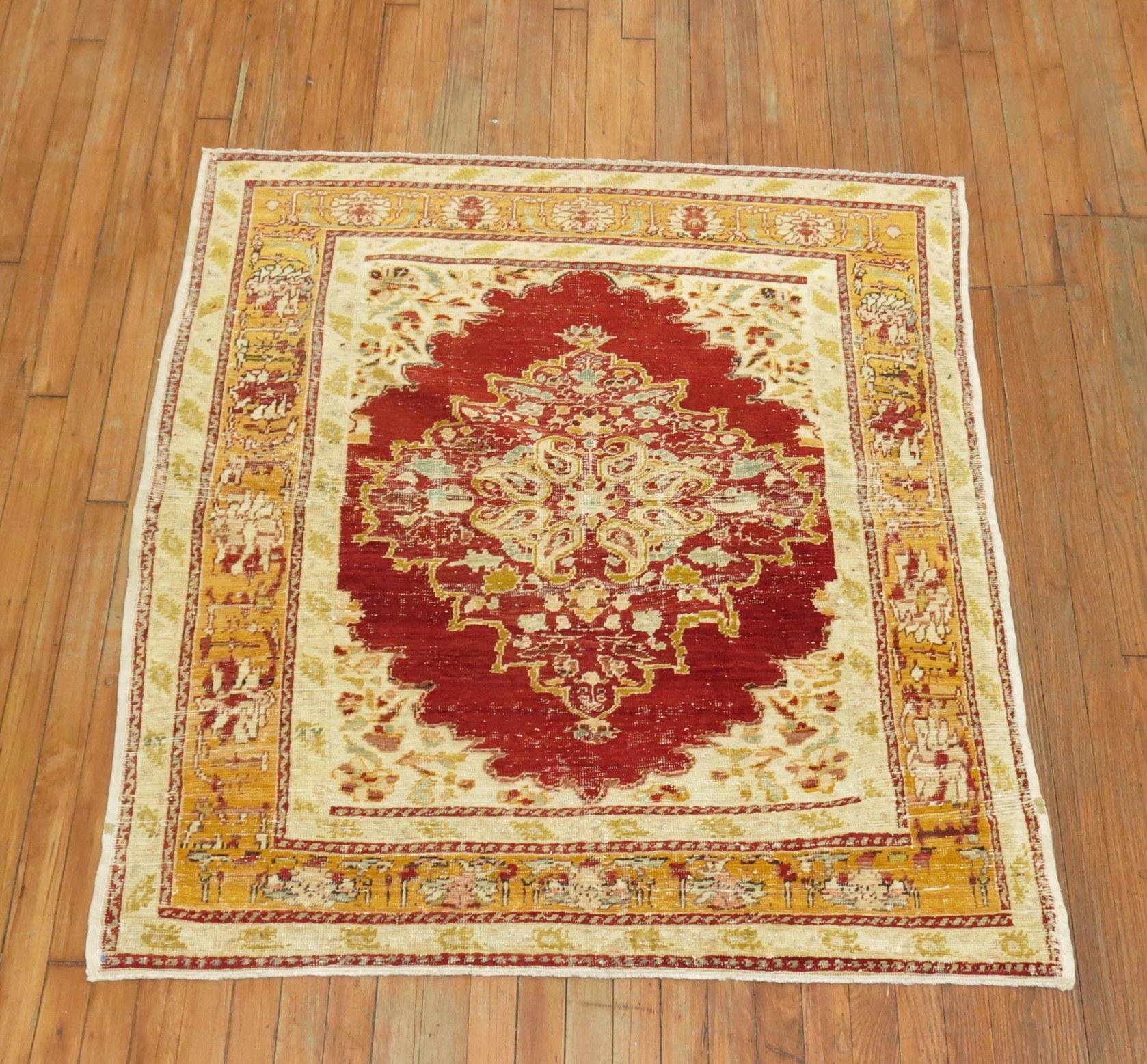 A square shaped finely woven antique Turkish sivas small rug.