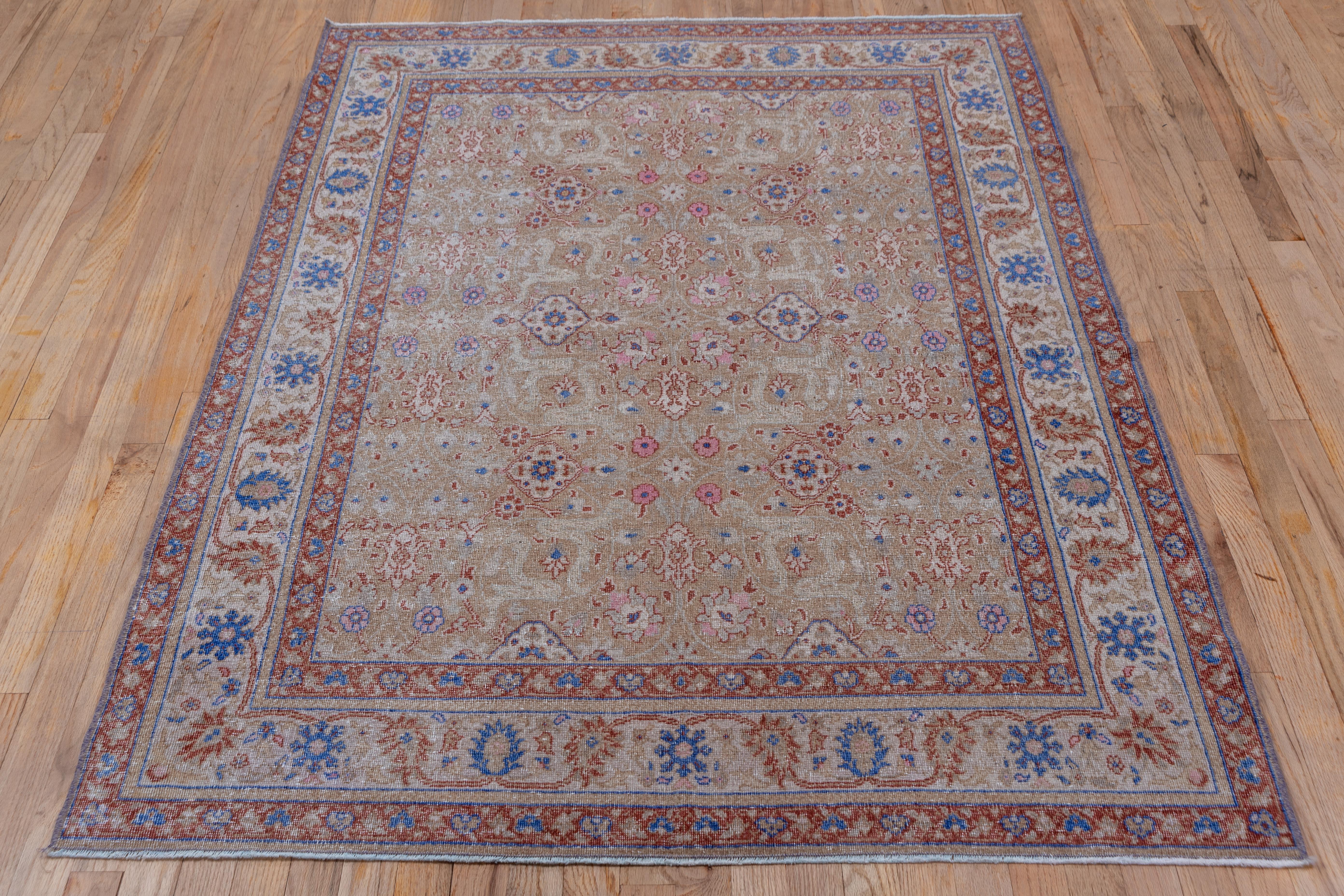 This somewhat distressed eastern Turkish town scatter has a buff field supporting an all-over pattern of ivory medallions, leafy cartouches, petal palmettes and small rosettes, detailed in ivory, brown, cerulean, and light teal. The ivory border