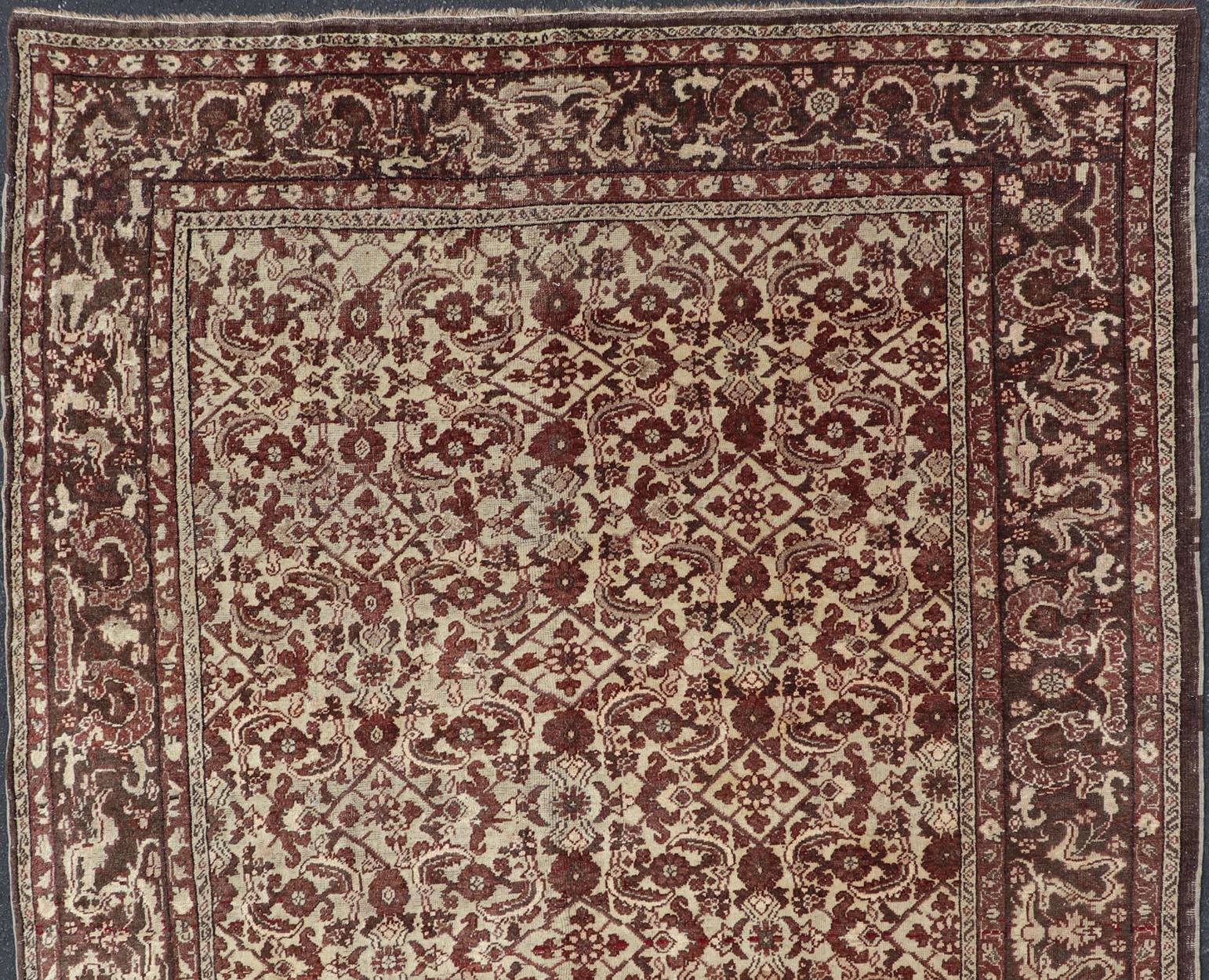 Stylized antique Turkish Sivas rug with Ivory background and Red maroon, Eggplant, Brown Colors rug V21-0601, country of origin / type: Turkey / Sivas, circa 1910

Stylized all-over motifs are featured in all over Herati pattern on this antique