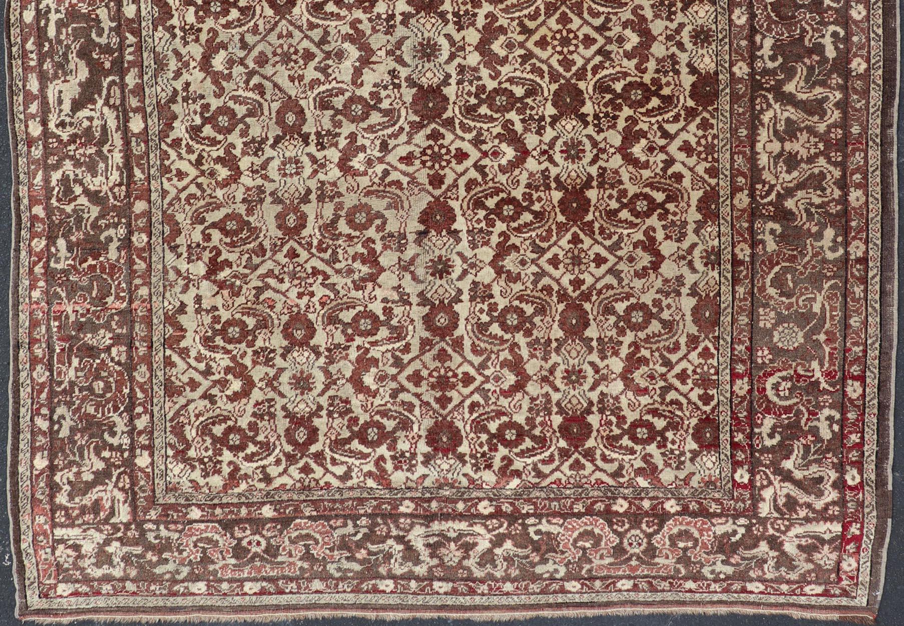 Hand-Knotted Antique Turkish Sivas Rug with Tan Background and Maroon, Eggplant, Brown Color  For Sale