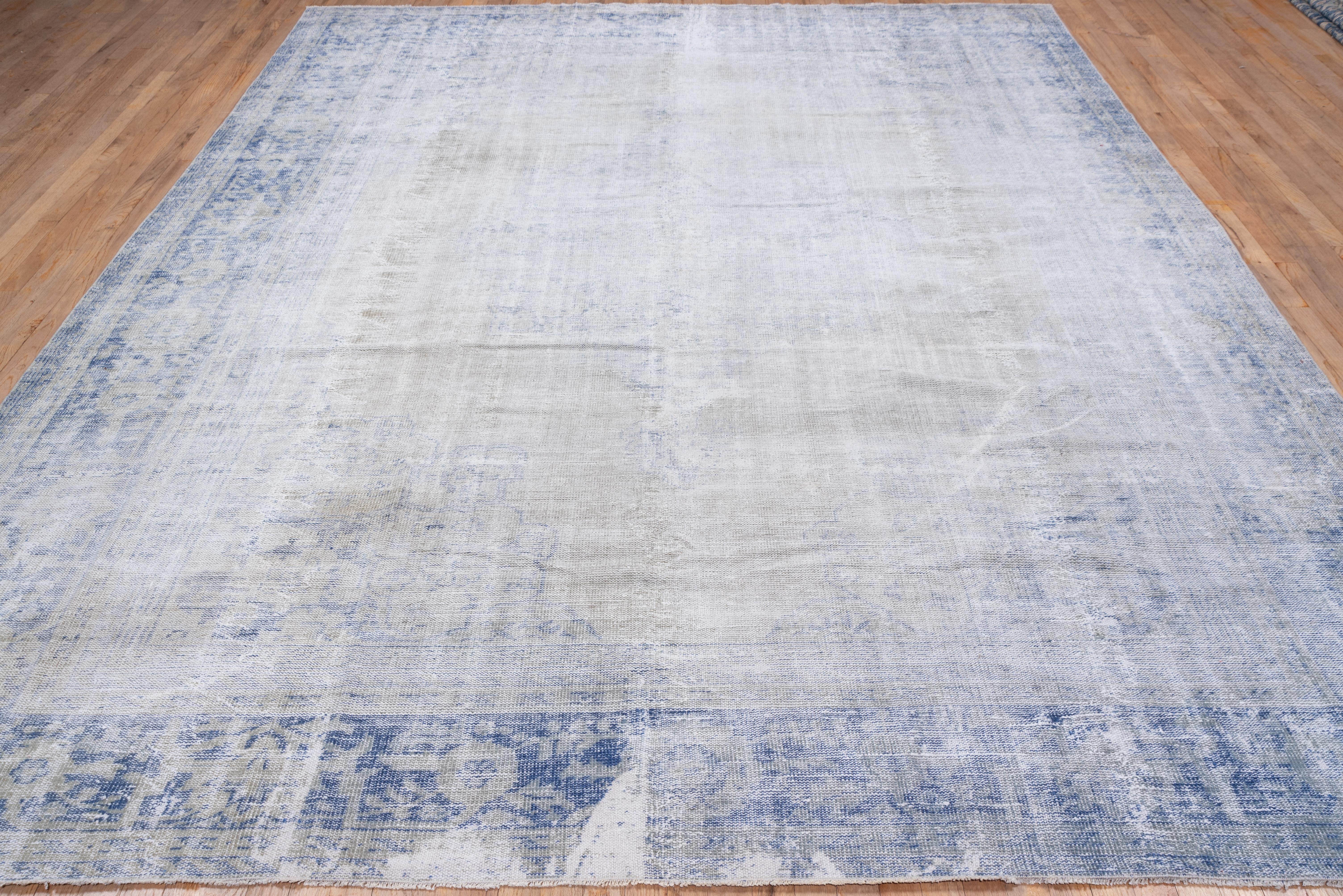 This distressed obliterated carpet allows the buyer to mentally, or otherwise, create he only trace of surviving pattern is the medium blue floriate border.