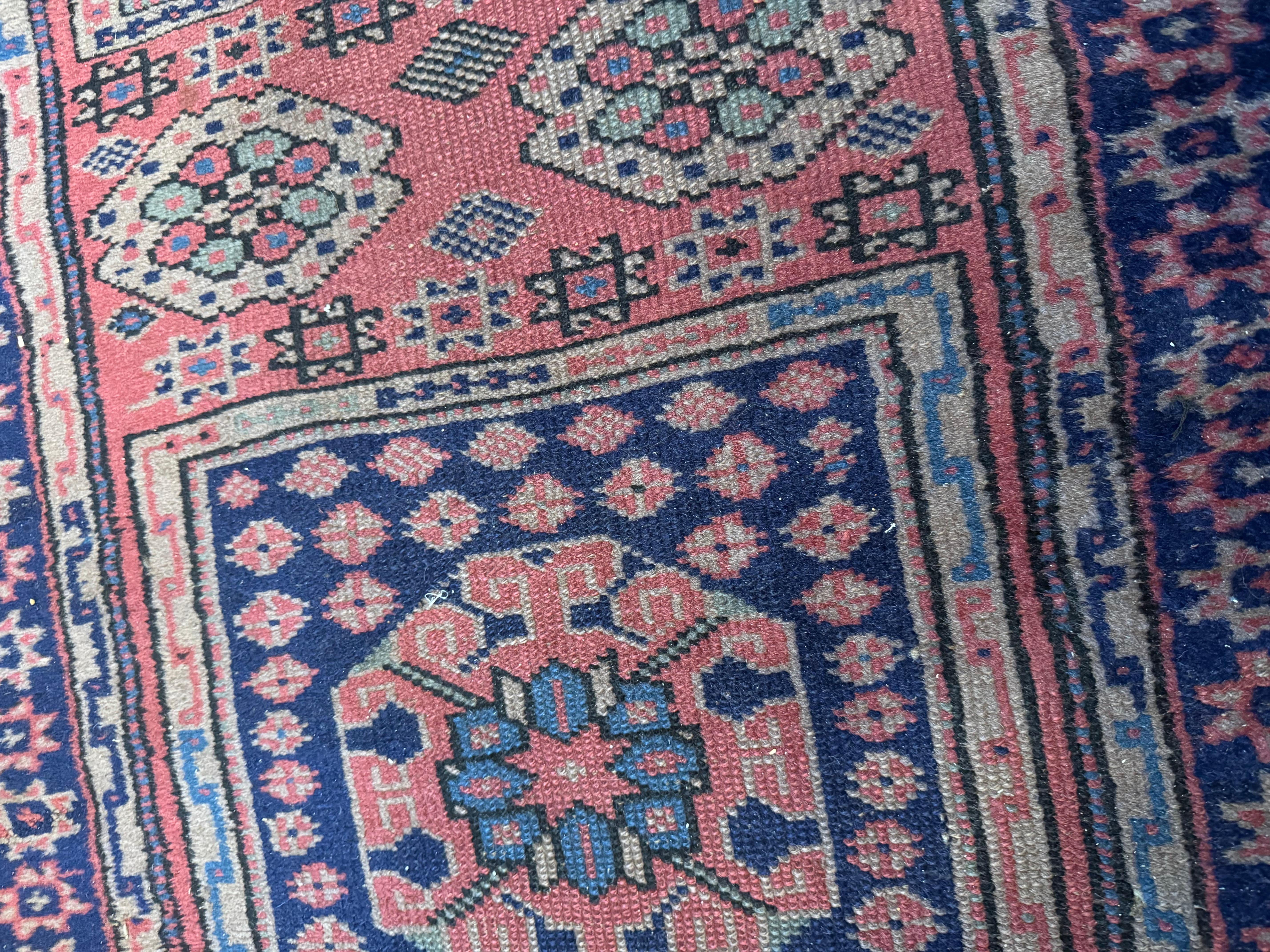 Mid-20th Century Antique Turkish Sparta Short and Narrow Pink Rose Geometric Runner Rug For Sale