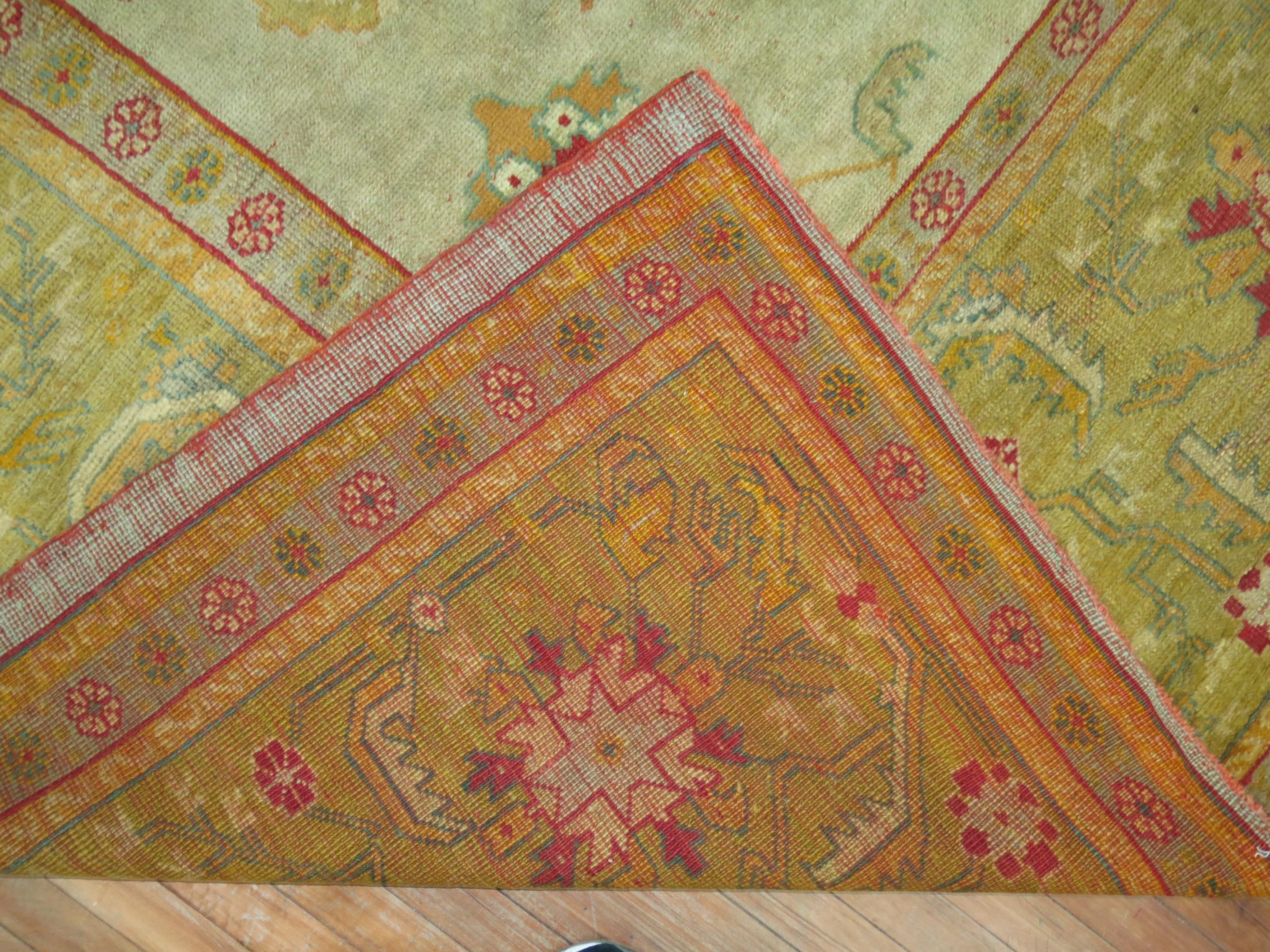 An early 20th century square size antique Turkish Oushak featuring an-all over design in warm colors.

Measures: 12' x 12'2''

Oushak rugs originated in the small town of Oushak in west-central Anatolia, today just south of Istanbul, Turkey.