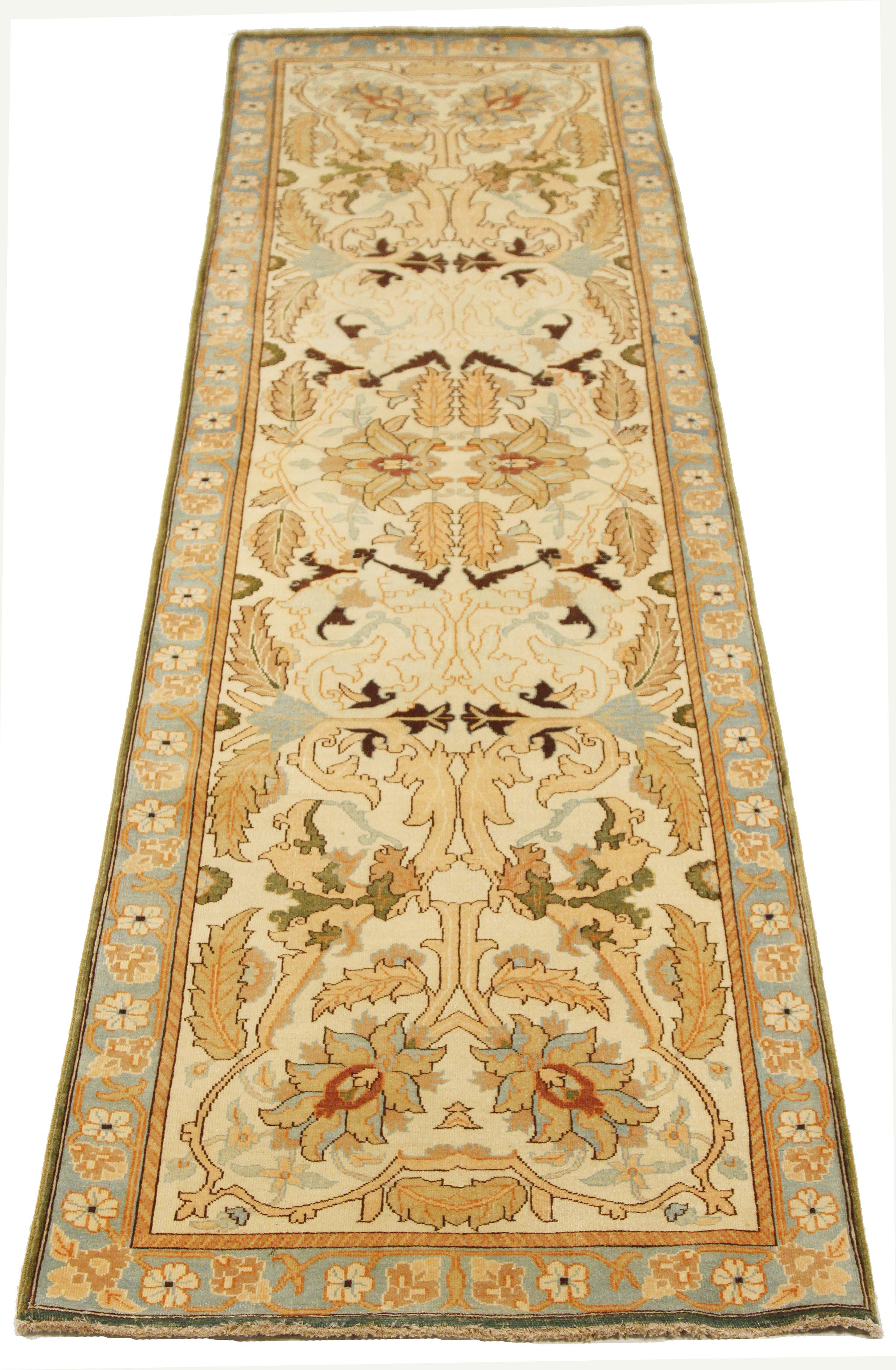 Antique Turkish rug handwoven from the finest sheep’s wool and colored with all-natural vegetable dyes that are safe for humans and pets. It’s a traditional Tabriz weaving featuring a lovely ensemble of floral designs in gray and beige over an ivory
