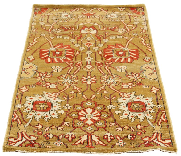 Antique Turkish rug handwoven from the finest sheep’s wool and colored with all-natural vegetable dyes that are safe for humans and pets. It’s a traditional Tabriz weaving featuring a lovely ensemble of floral designs in red and white over a brown