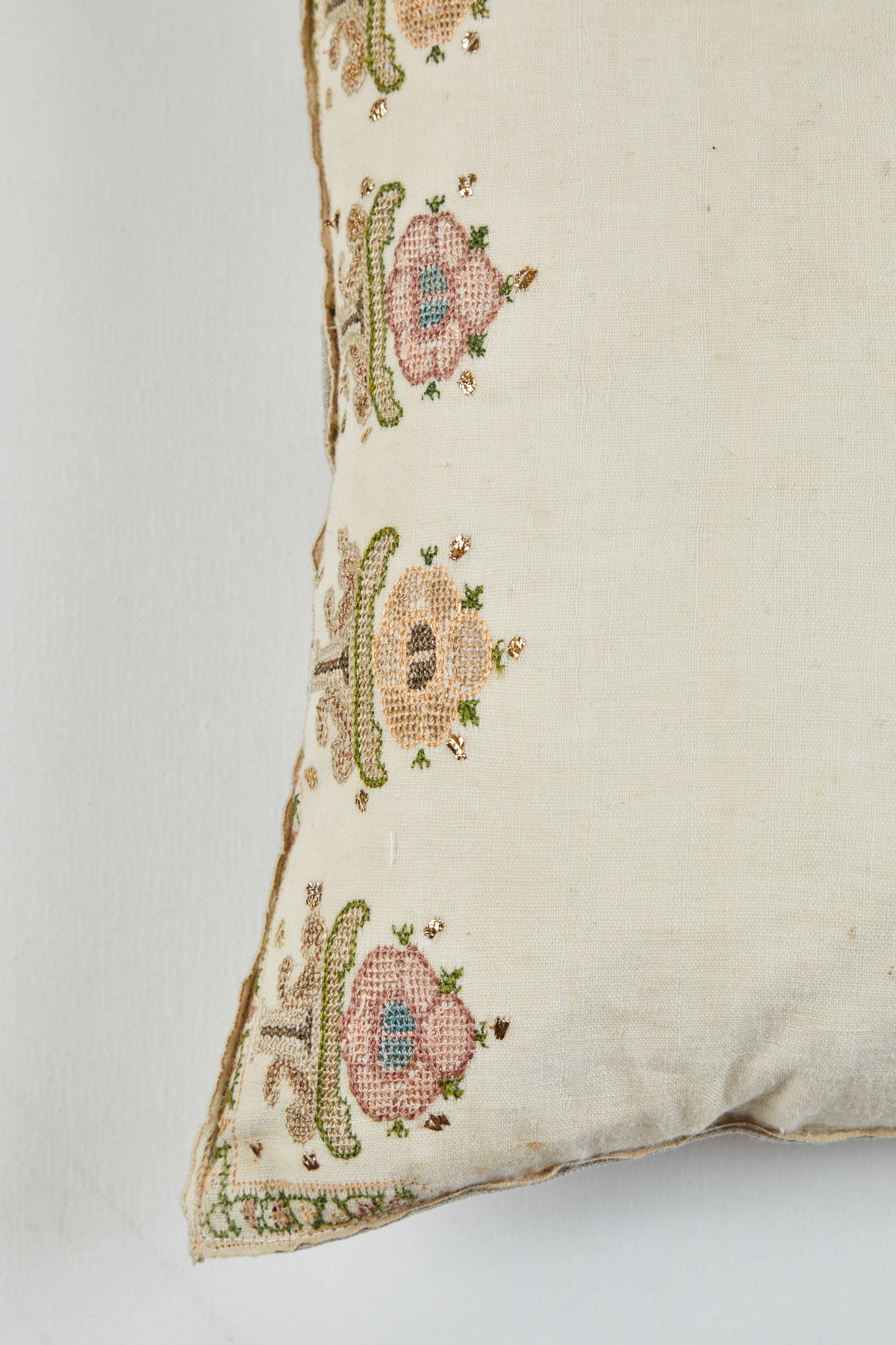 Intricate silk embroidery on handwoven linen. Natural linen back. Feather and down fill. Zipper closure.
 
 