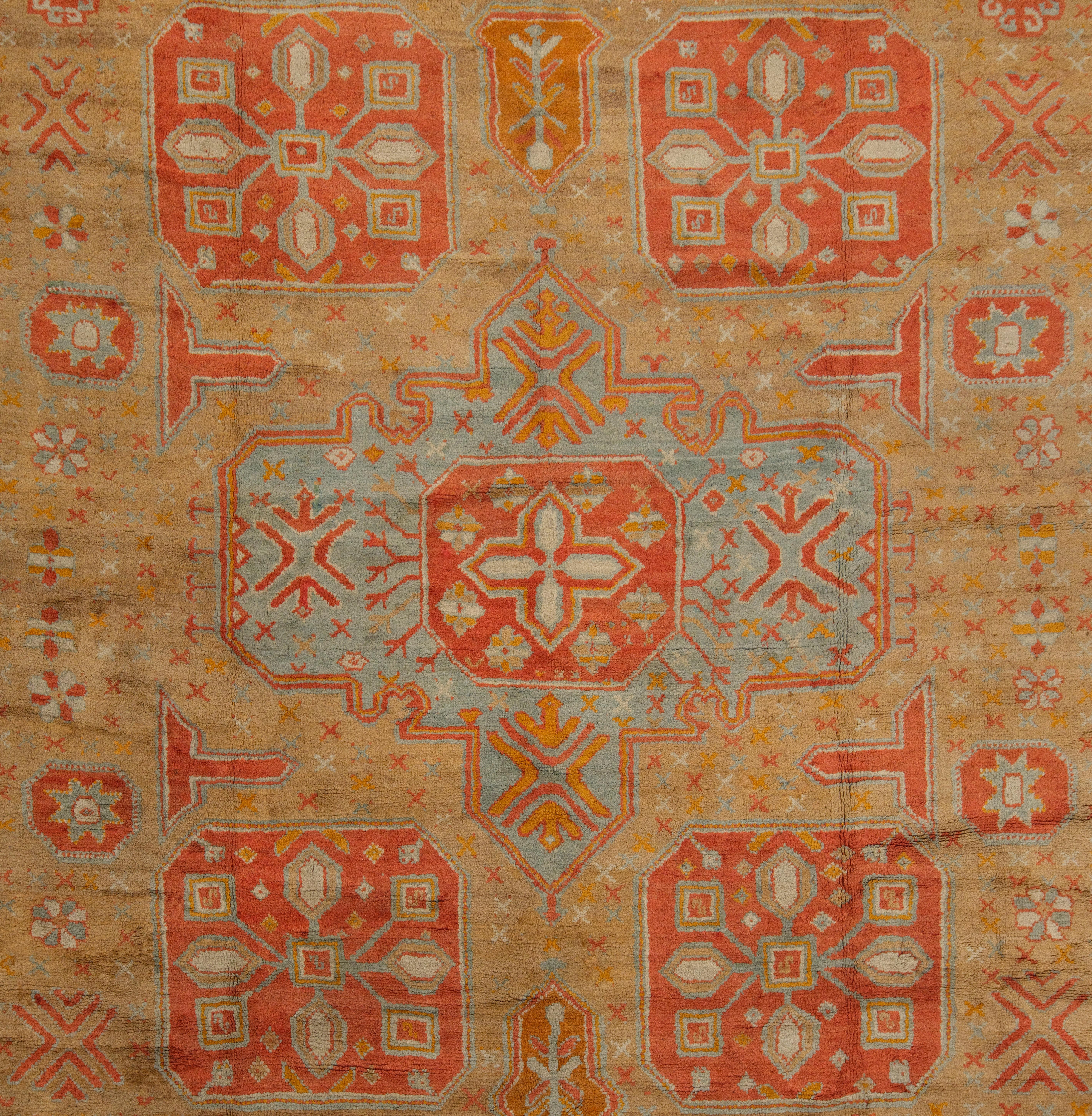 Late 19th century West Anatolia Ushak rug.
A large camel - ground Ushak workshop carpet produced for export. Popular in Europa and the USA, circa 1800, carpets of this kind are usually of coarse weave. They're simply drawn designs – here including a