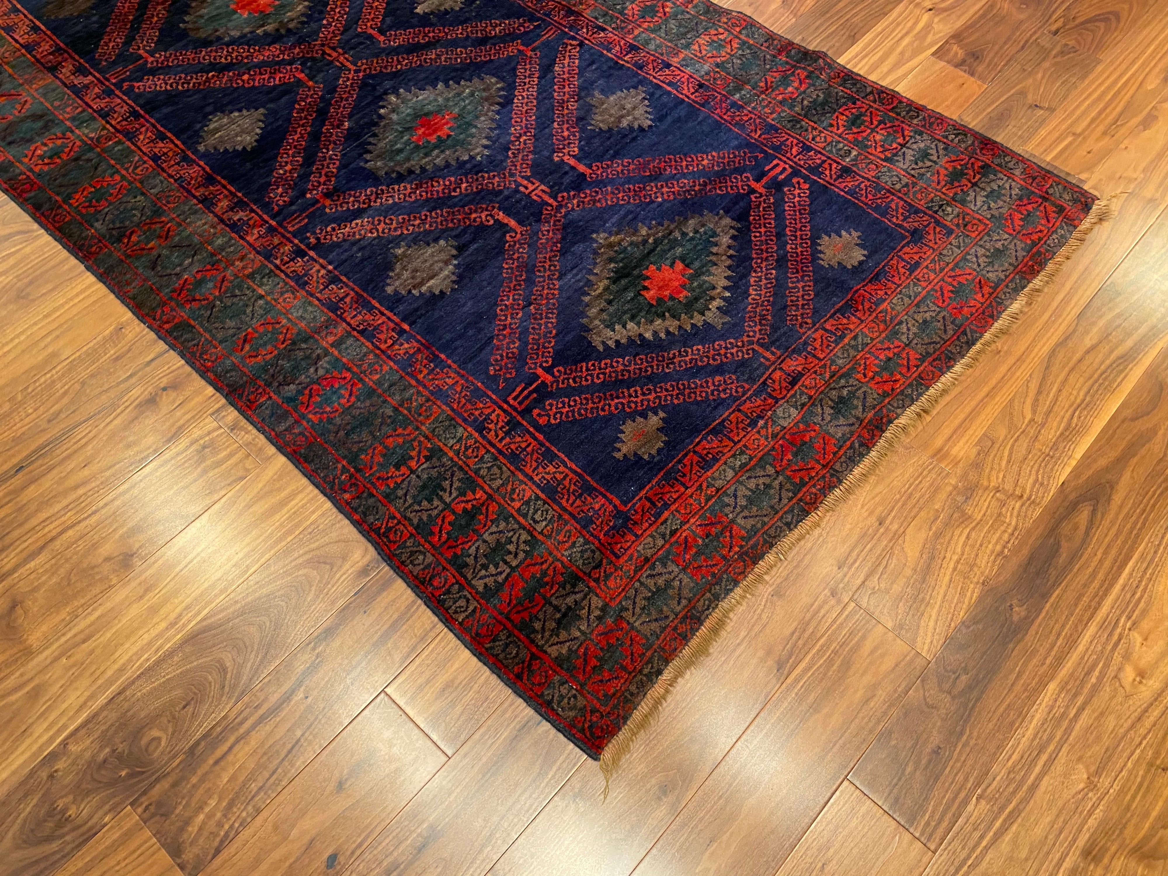 Antique Turkish wool rug with primary. Colors of dark navy and burnt orange. Great color and size.