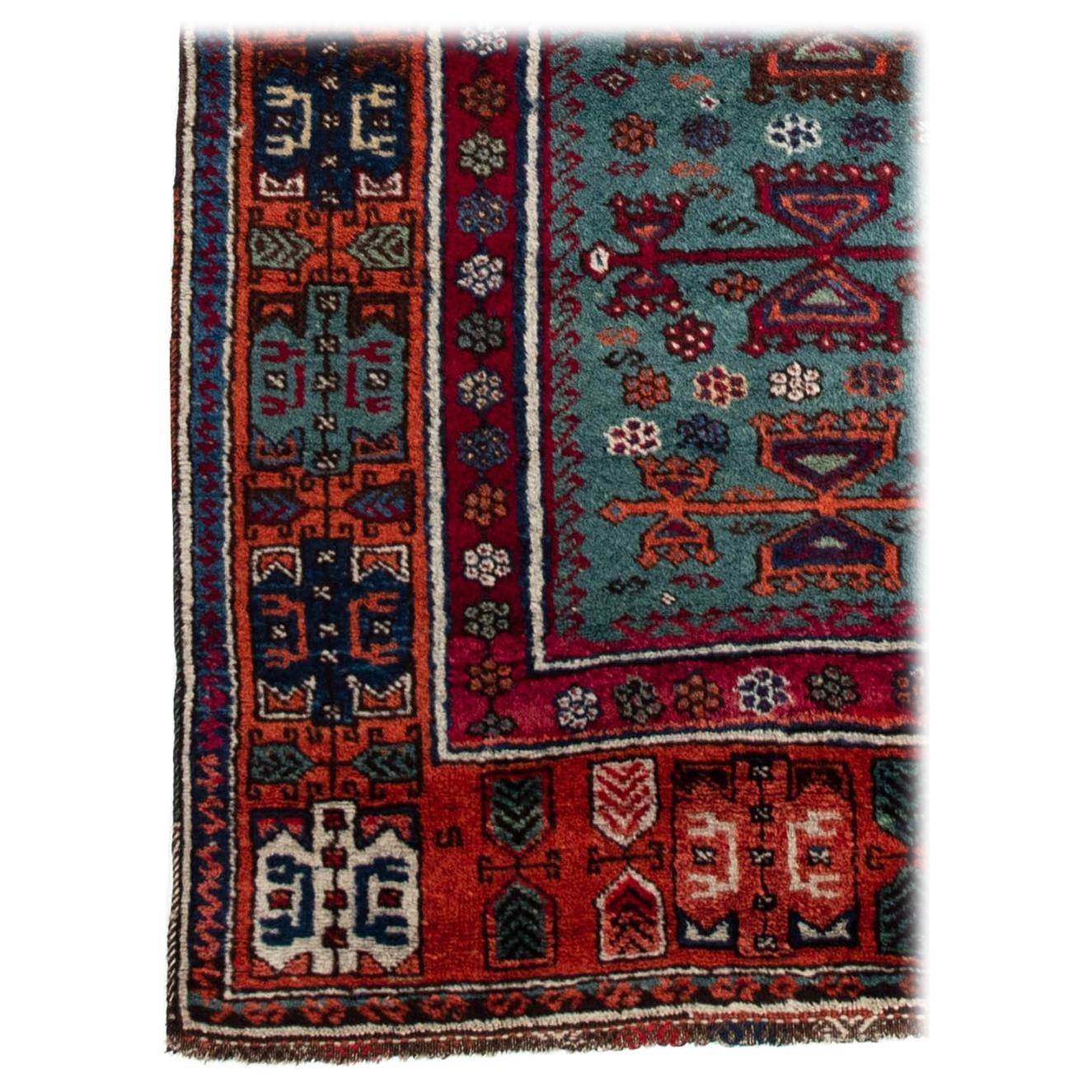 This antique tribal Yoruk prayer rug was woven in the late 19th century in South-eastern Anatolia, the center of the Ottoman Empire during that time. Yoruk carpets represent a long traditional of fine textile manufacturing from tribal groups moving